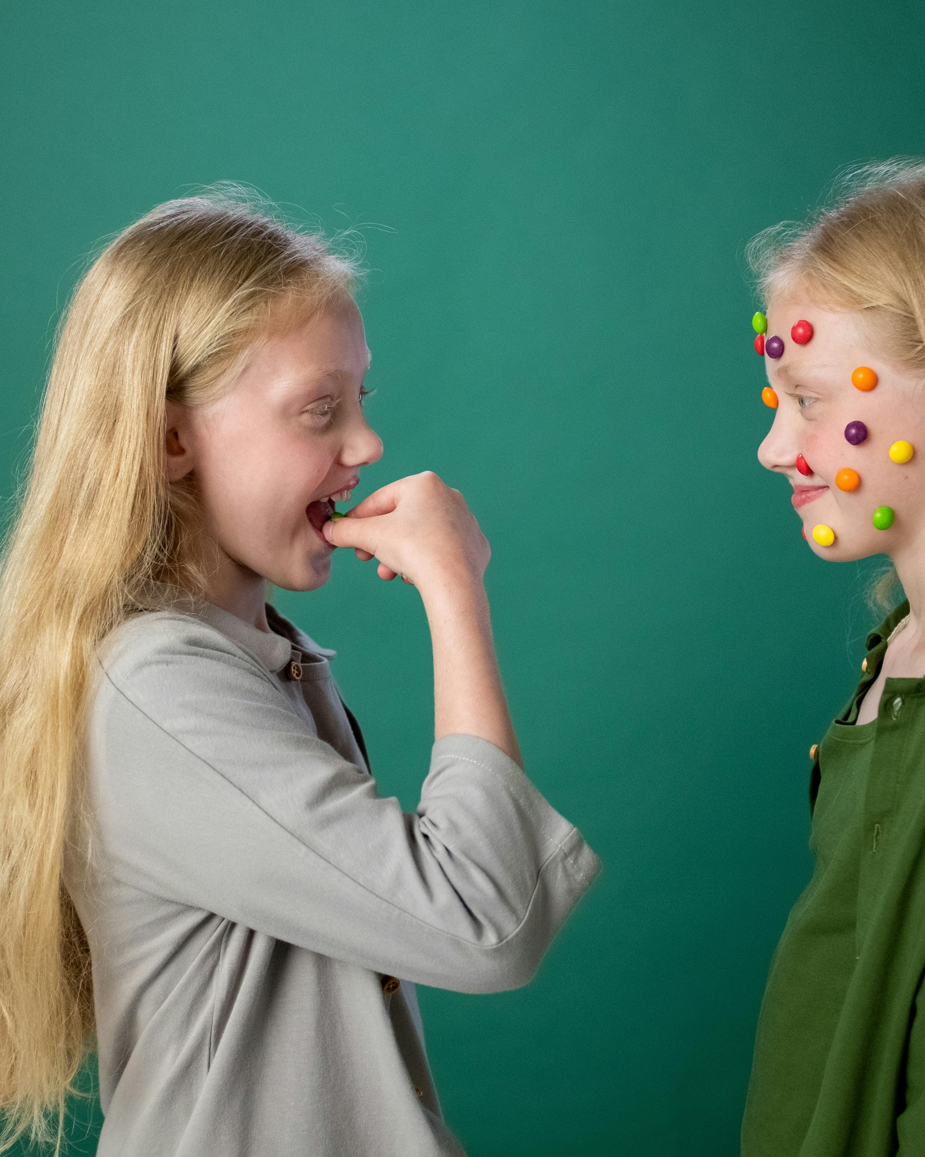 Two Girls Playing With Candy