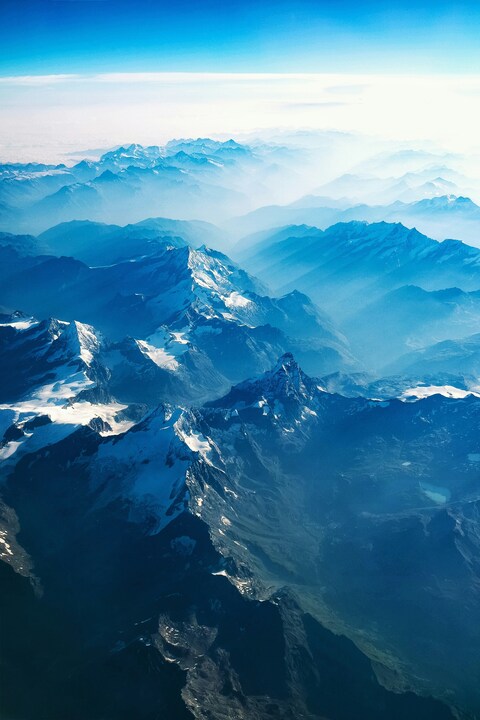 Aerial View of Snow-capped Mountains