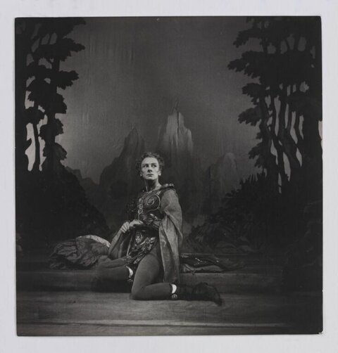 Kneeling Actor in Theatrical Stage Scene