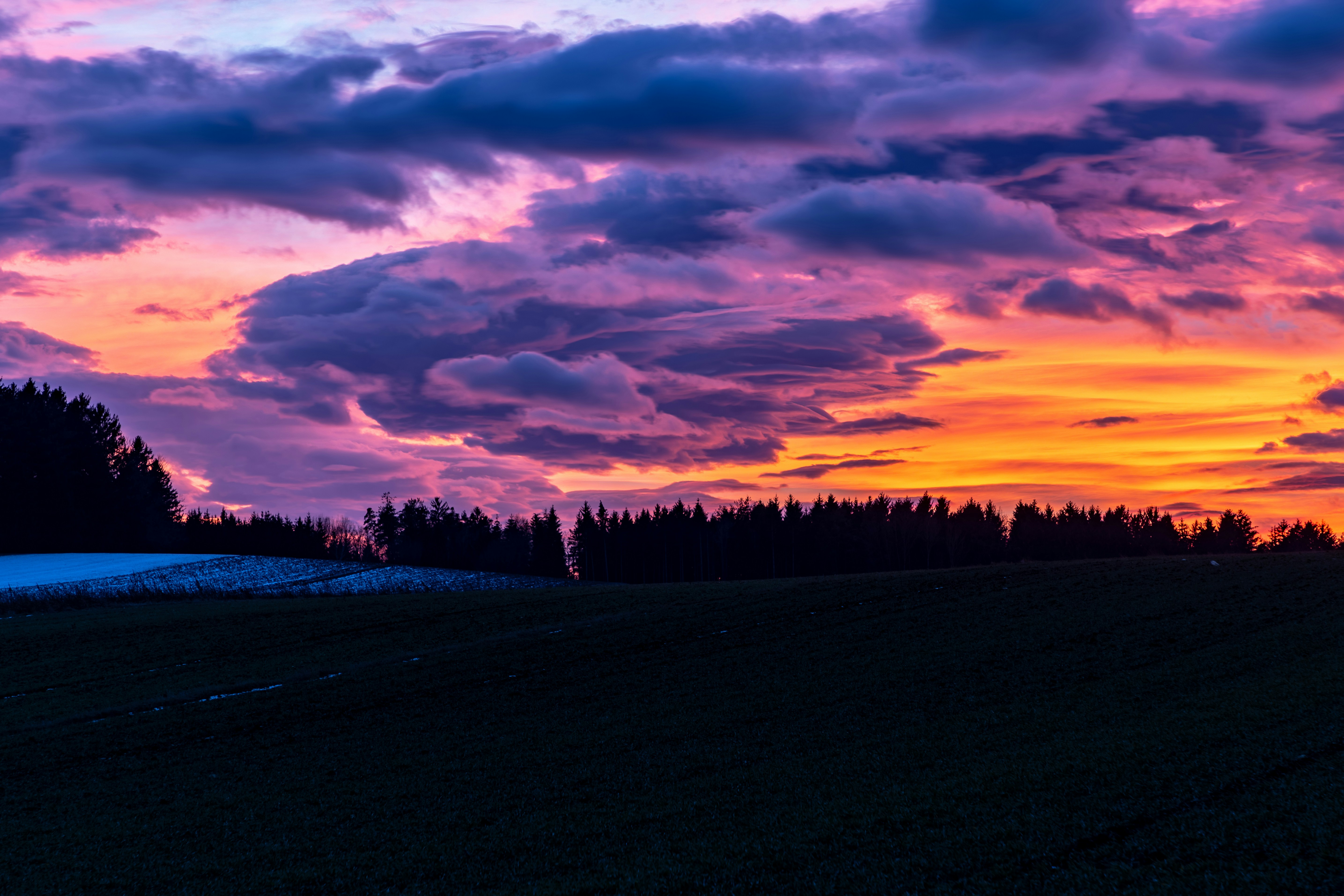 Colorful Sunset Over Countryside Field