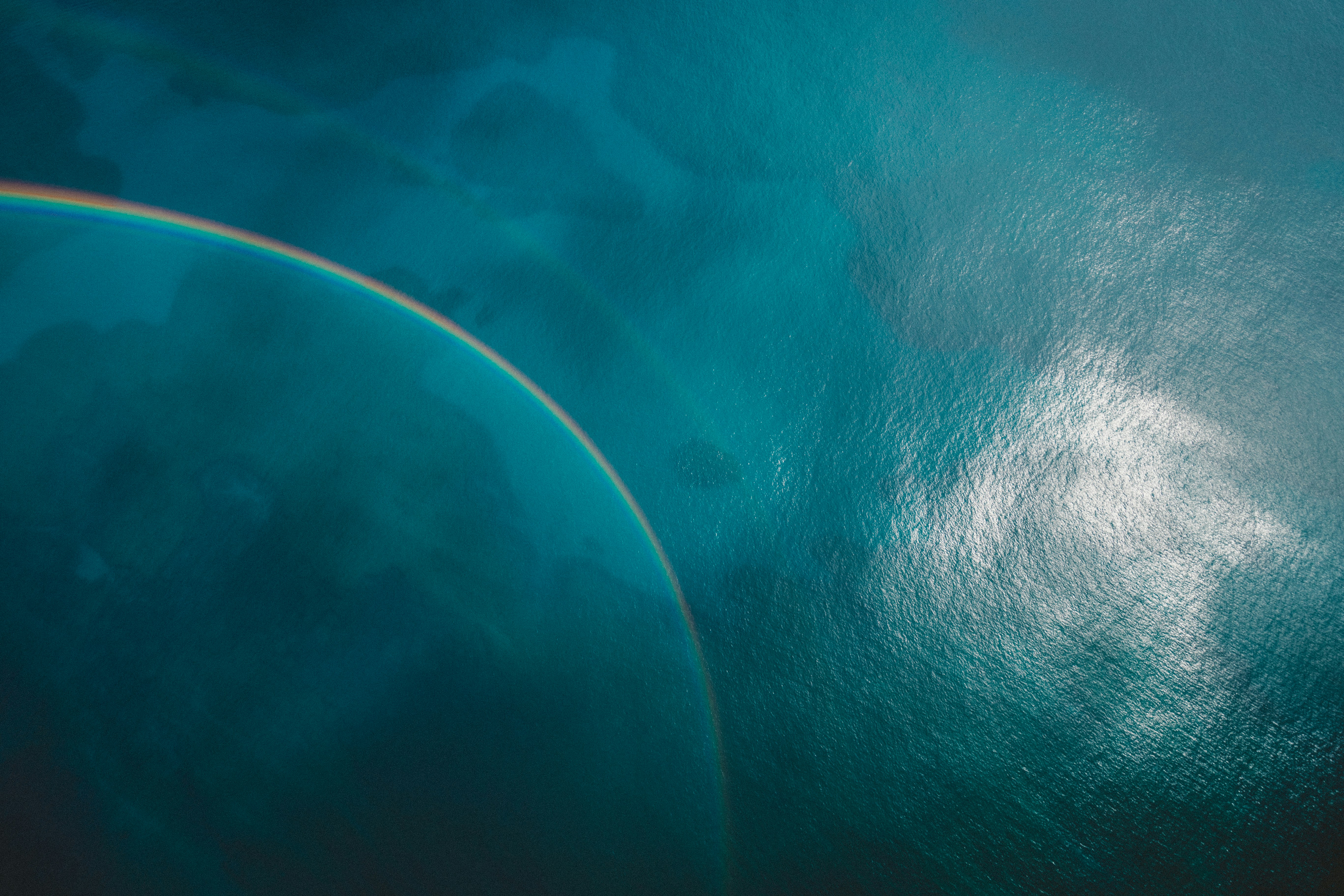 Rainbow Over Blue Sea