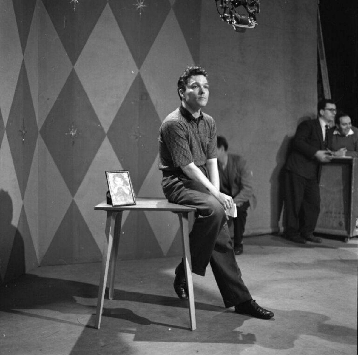 Actor Seated on Stage During Rehearsal