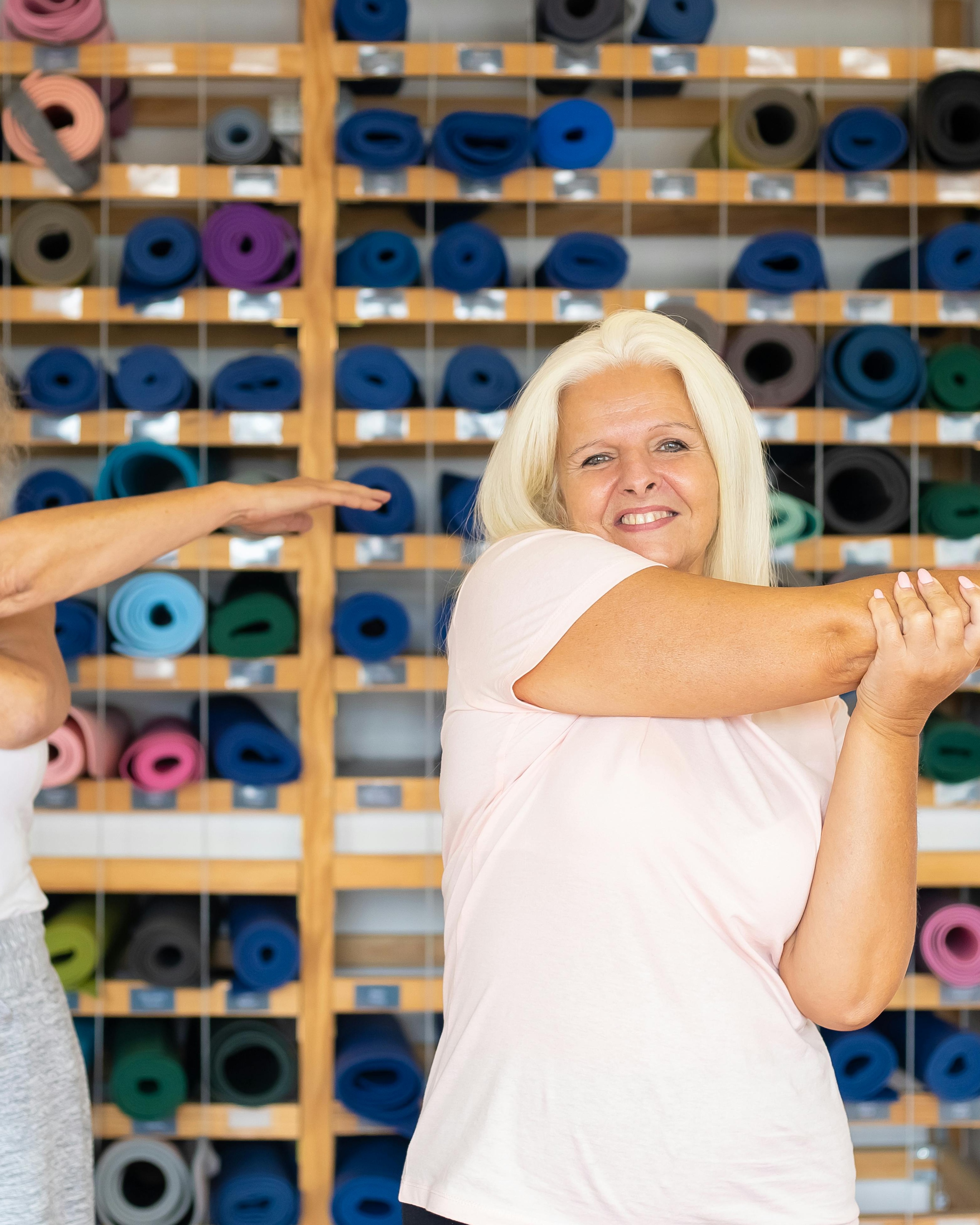 Mature Women Stretching Before Yoga