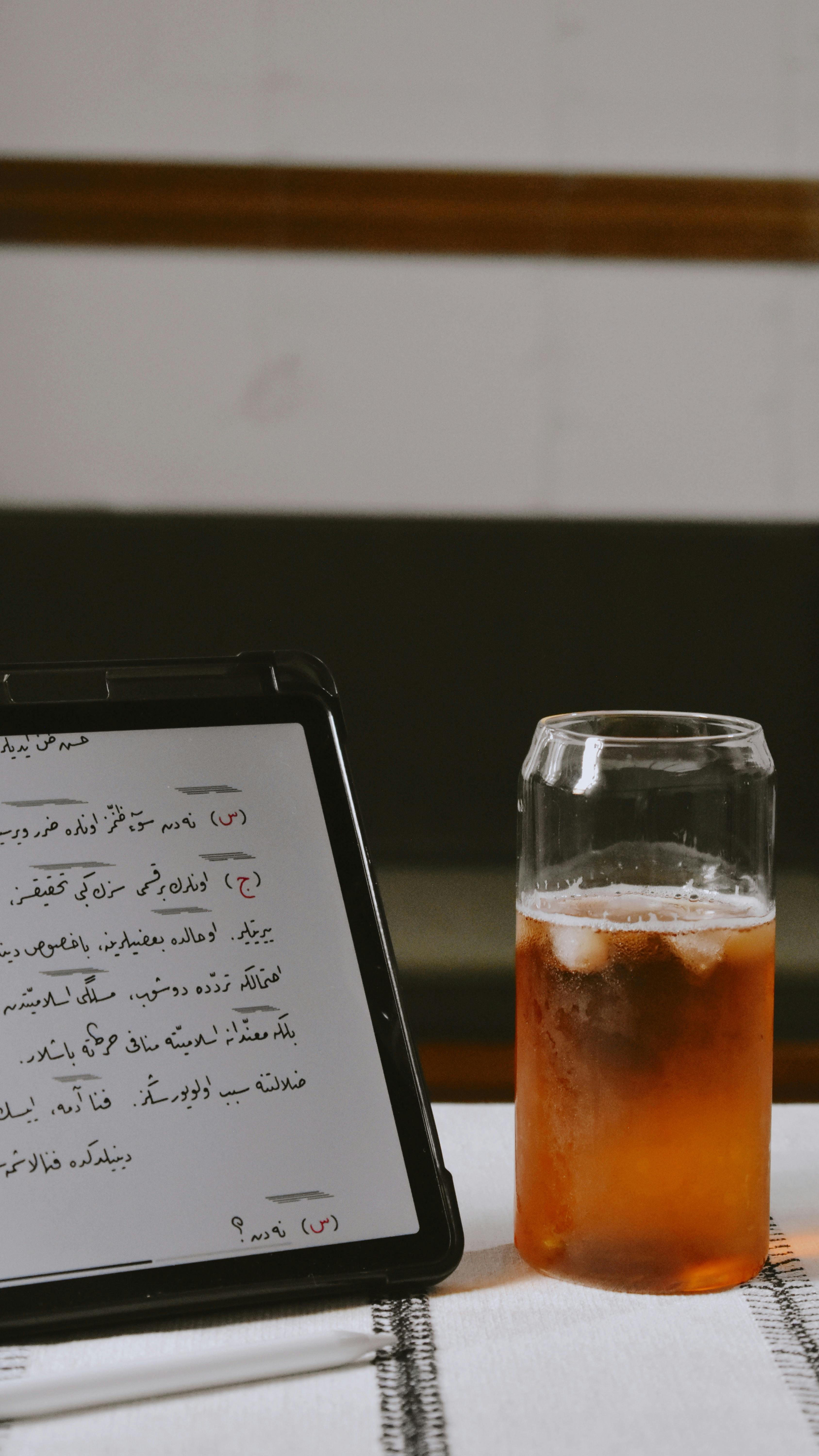 Iced Tea and Tablet With Handwritten Notes