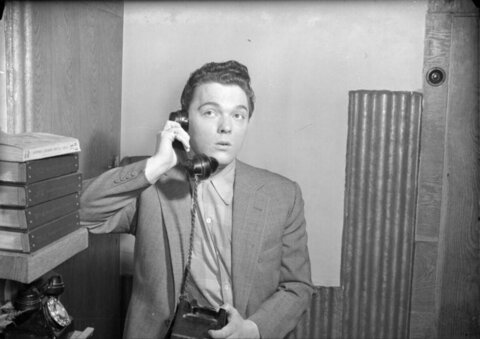 Surprised Man on Vintage Telephone