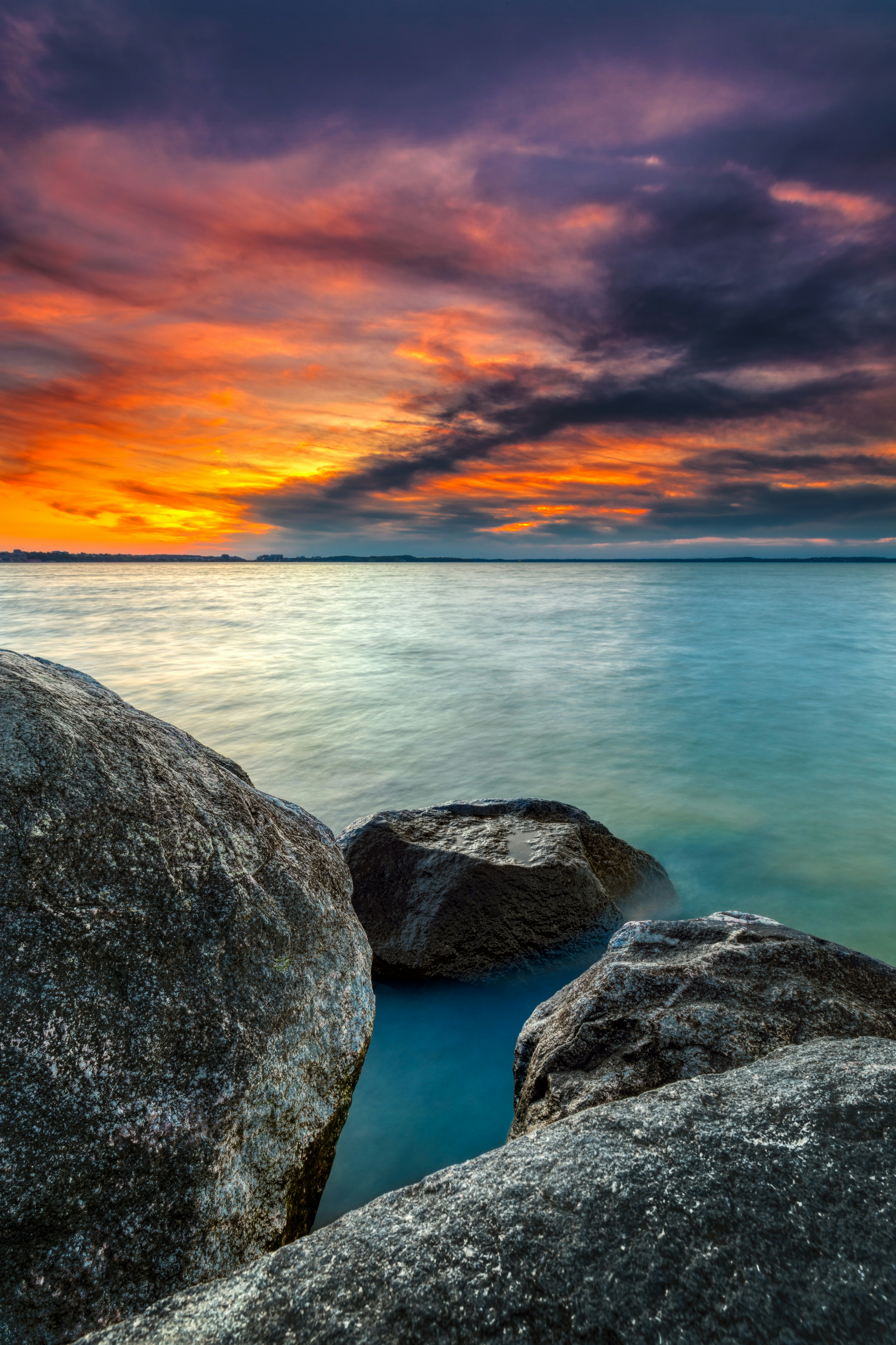 Sunset Over Rocky Shoreline