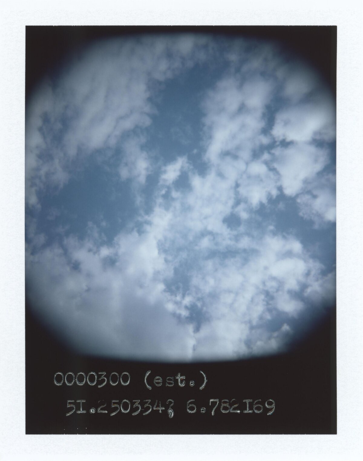 Blue Sky with Clouds and Coordinate Text