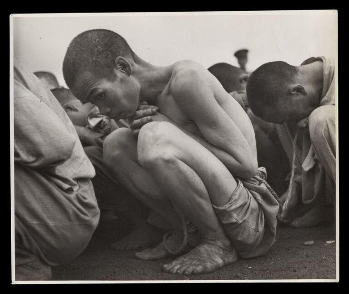 Emaciated Crouching Starving Man