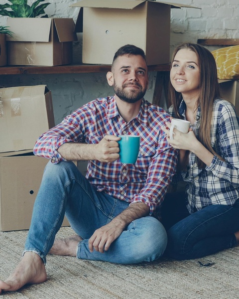 Young Couple Resting After Moving House