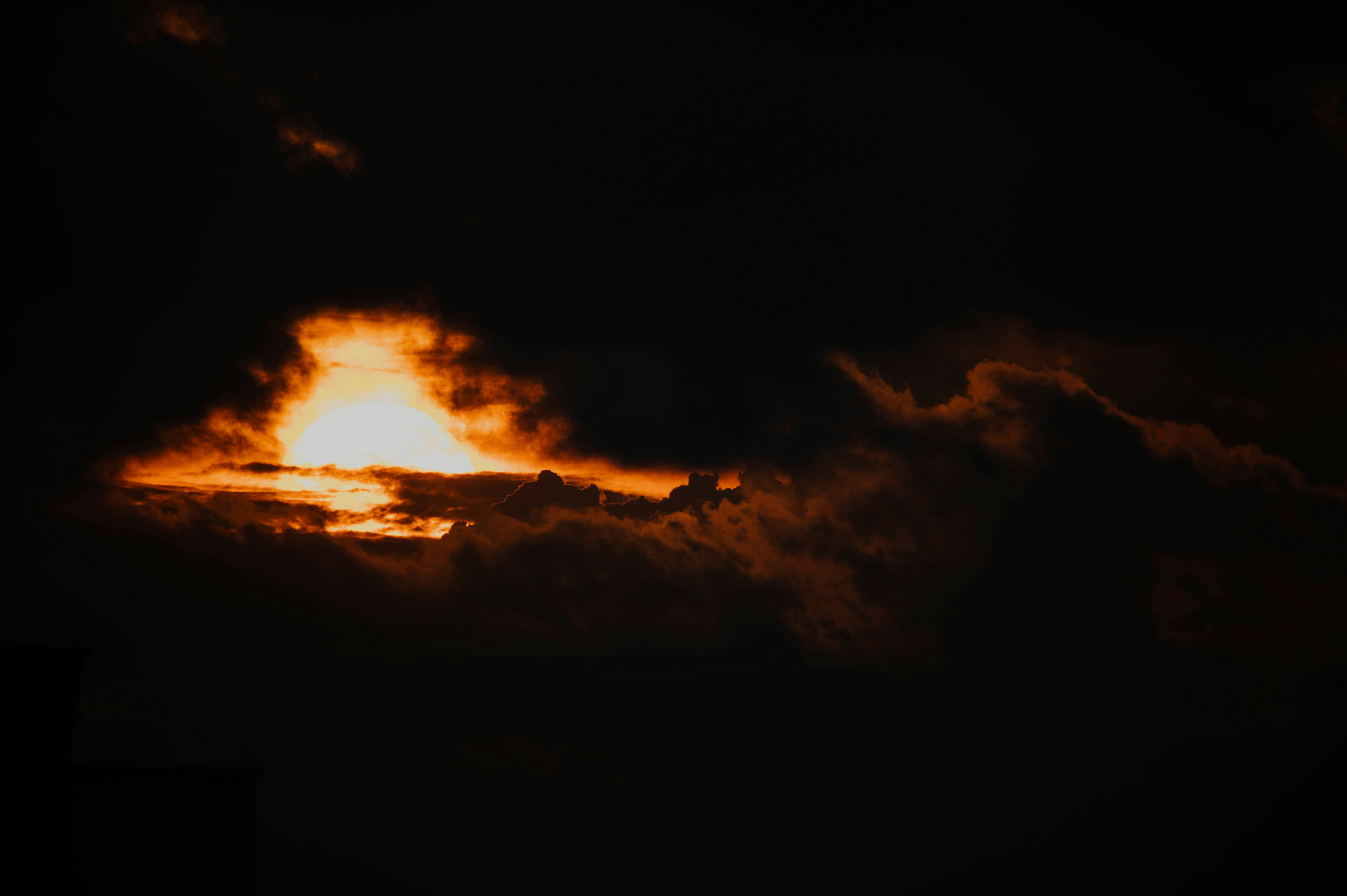 Setting Sun Behind Dark Clouds