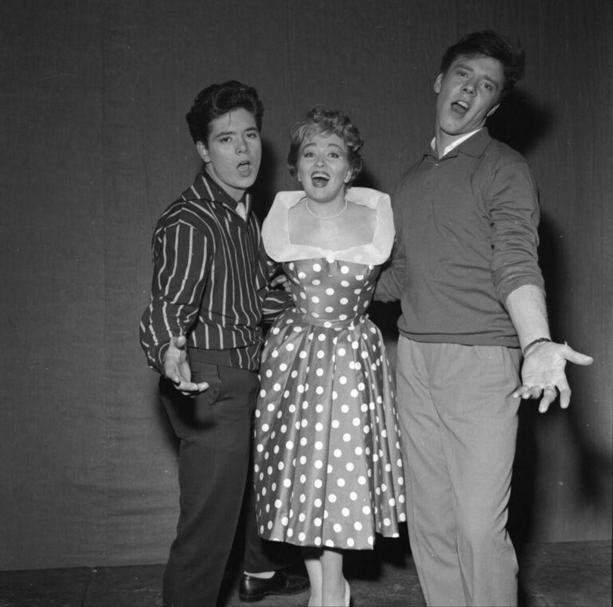 Three Singers Performing Together