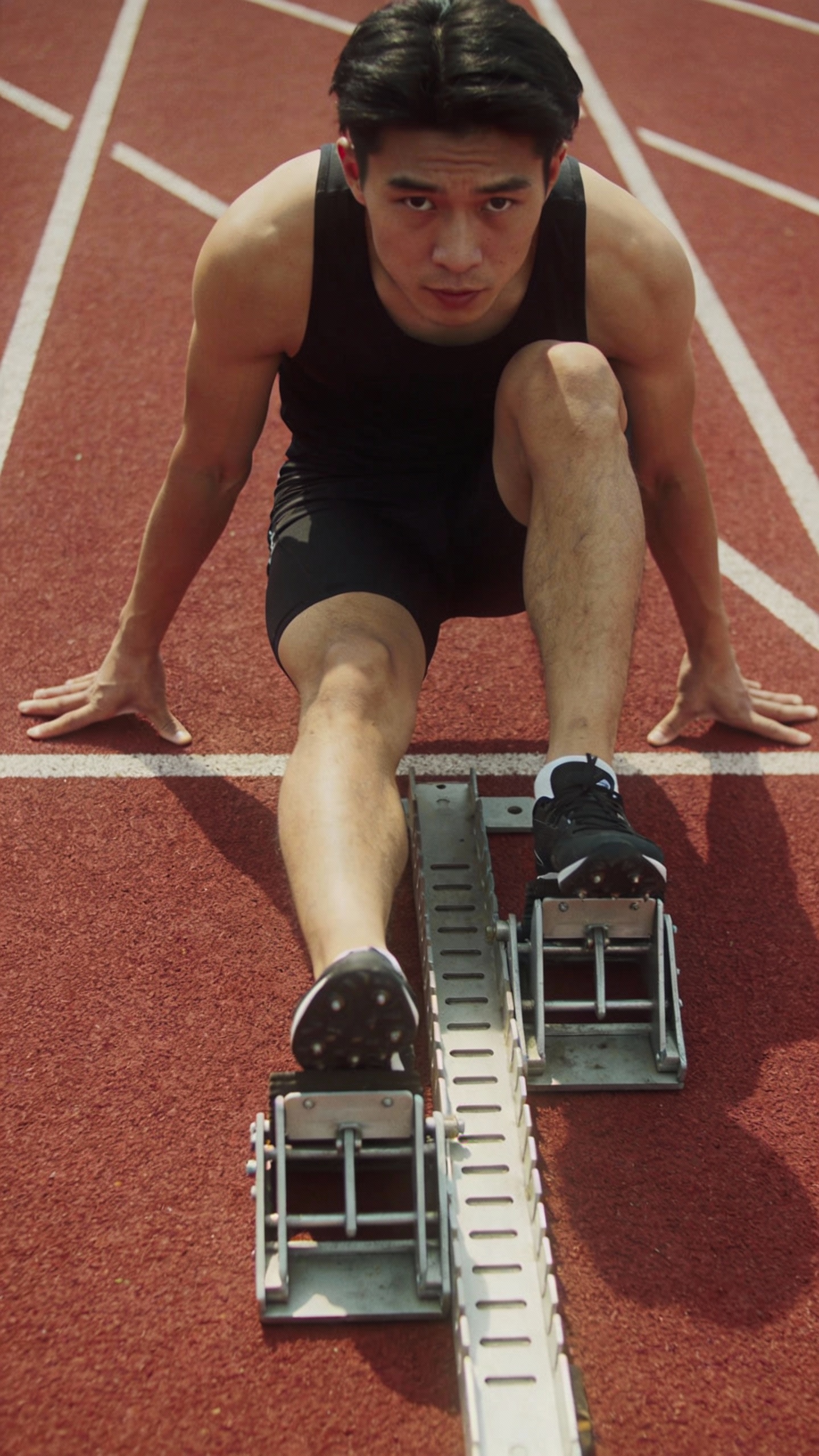 Sprinter in Starting Position on Track