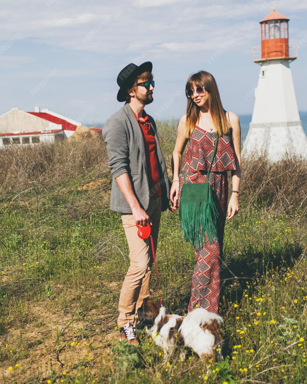 Couple With Dog Walking Near Lighthouse