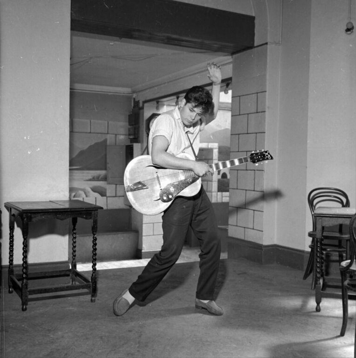 Young Man Playing Guitar Indoors
