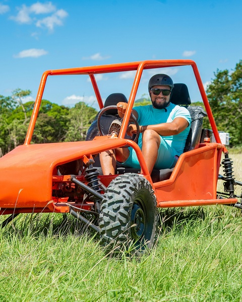 Man in Orange Off-Road Buggy