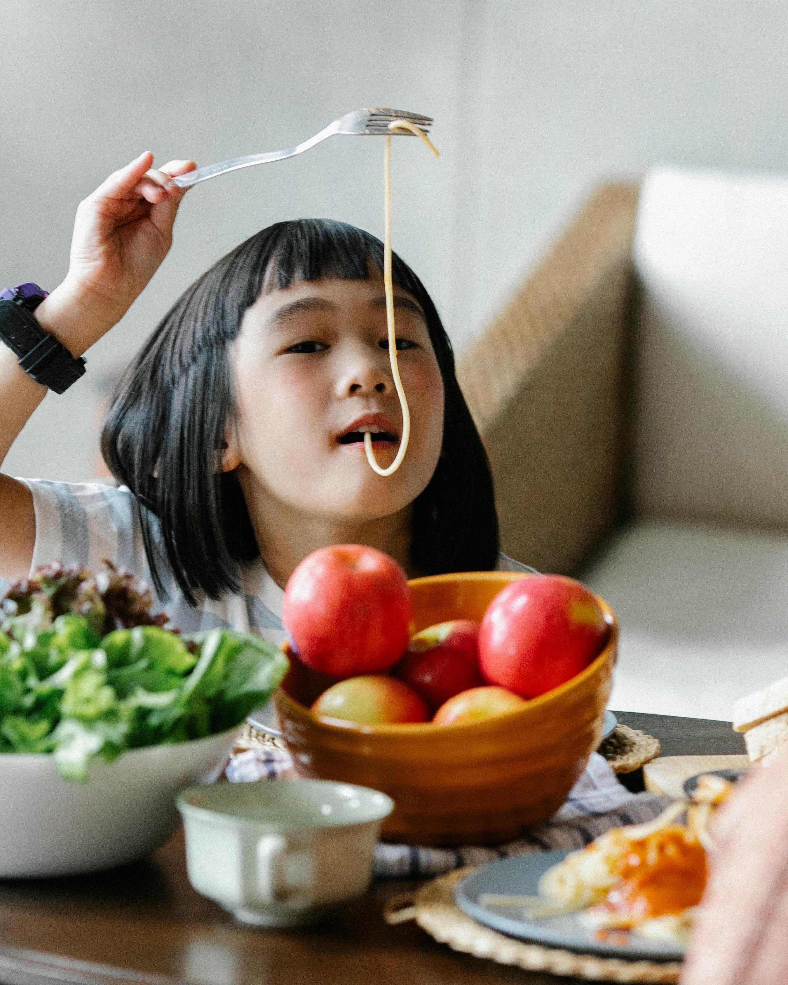 Young Girl Playing With Spaghetti