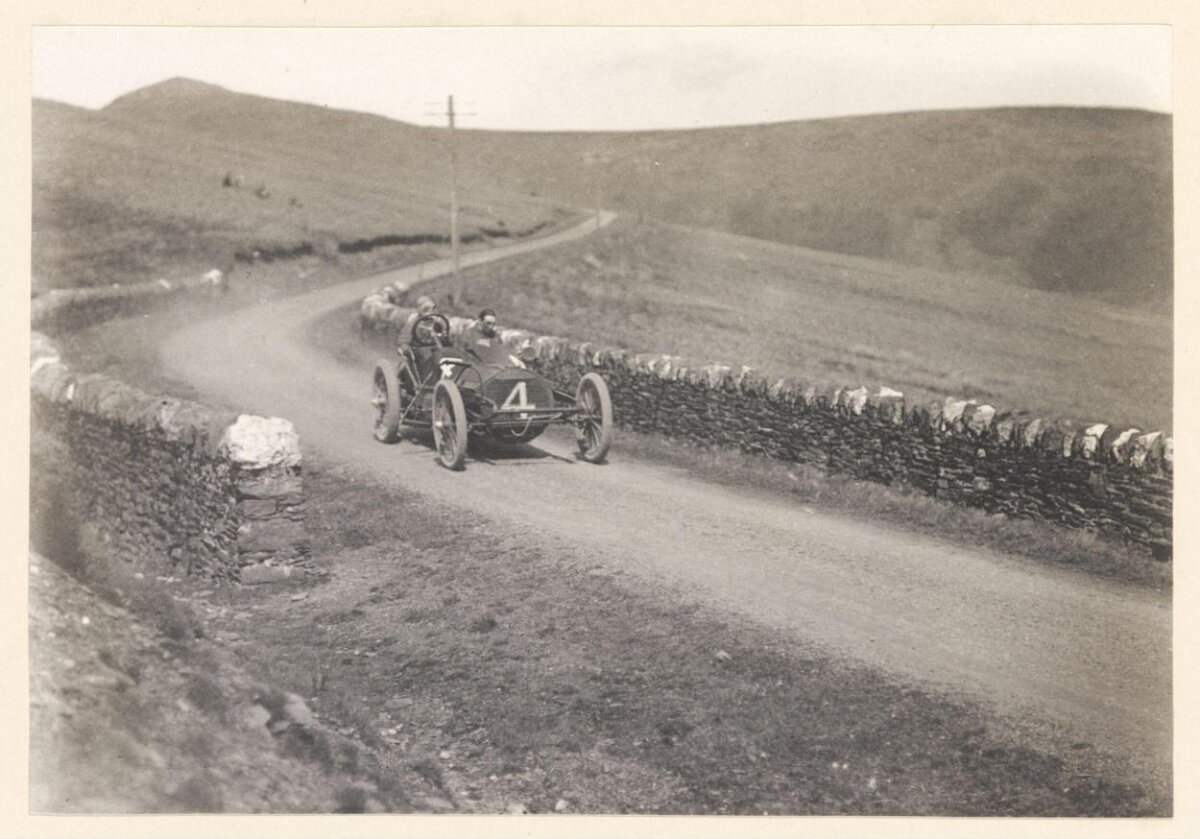 Vintage Race Car on Winding Hill Road