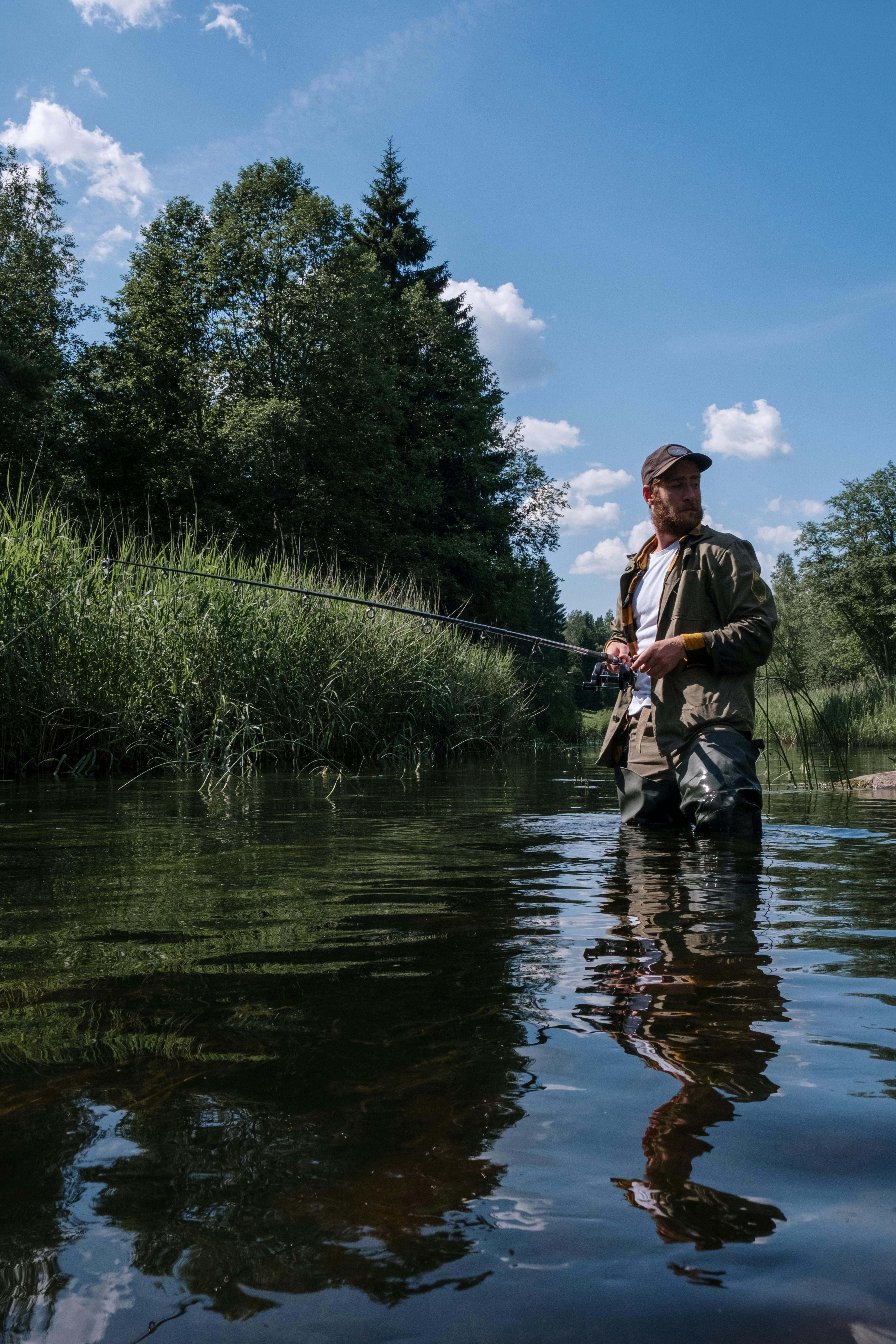 Fisherman Wading Fishing in a River