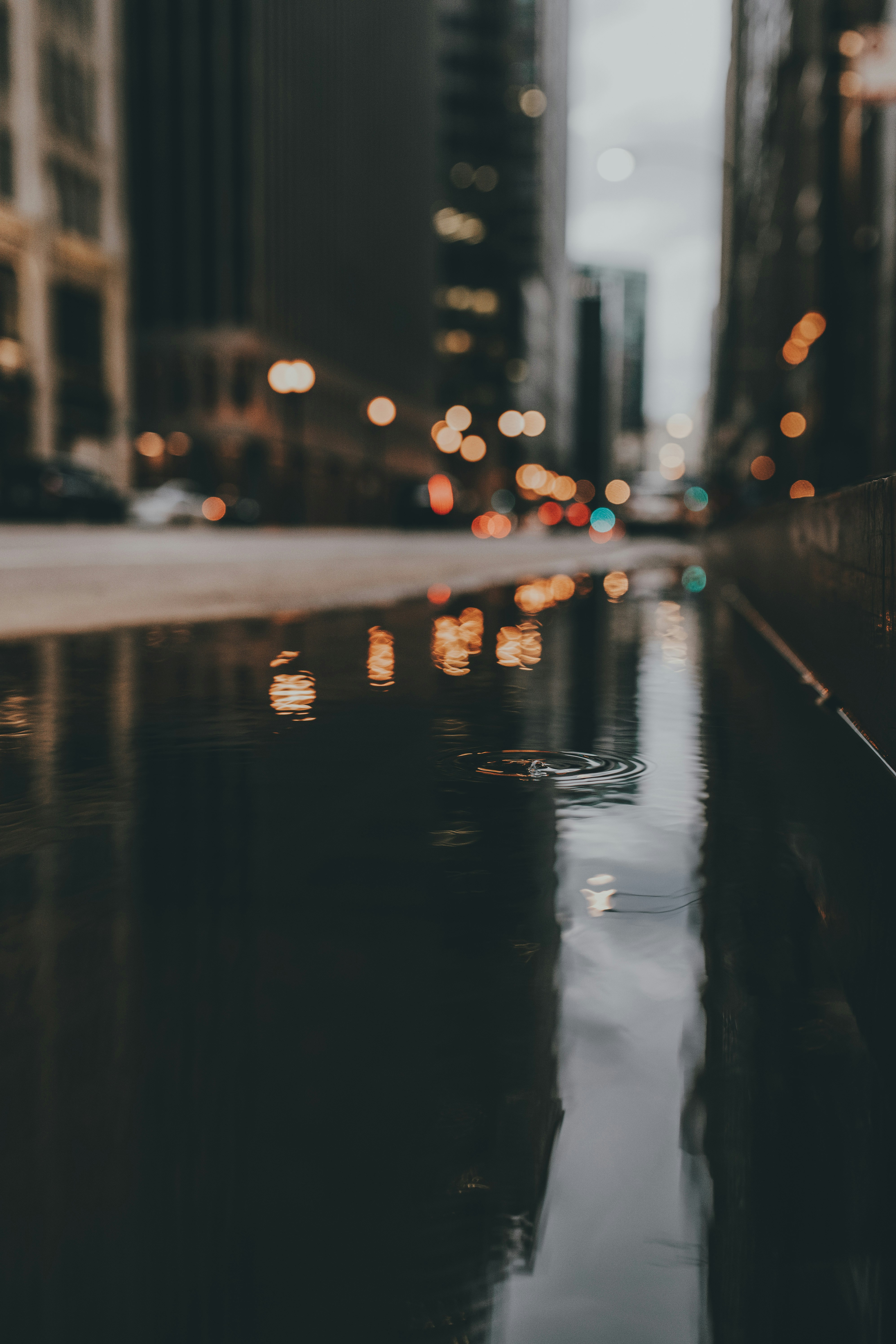 Rainy Urban Street Puddle Reflection