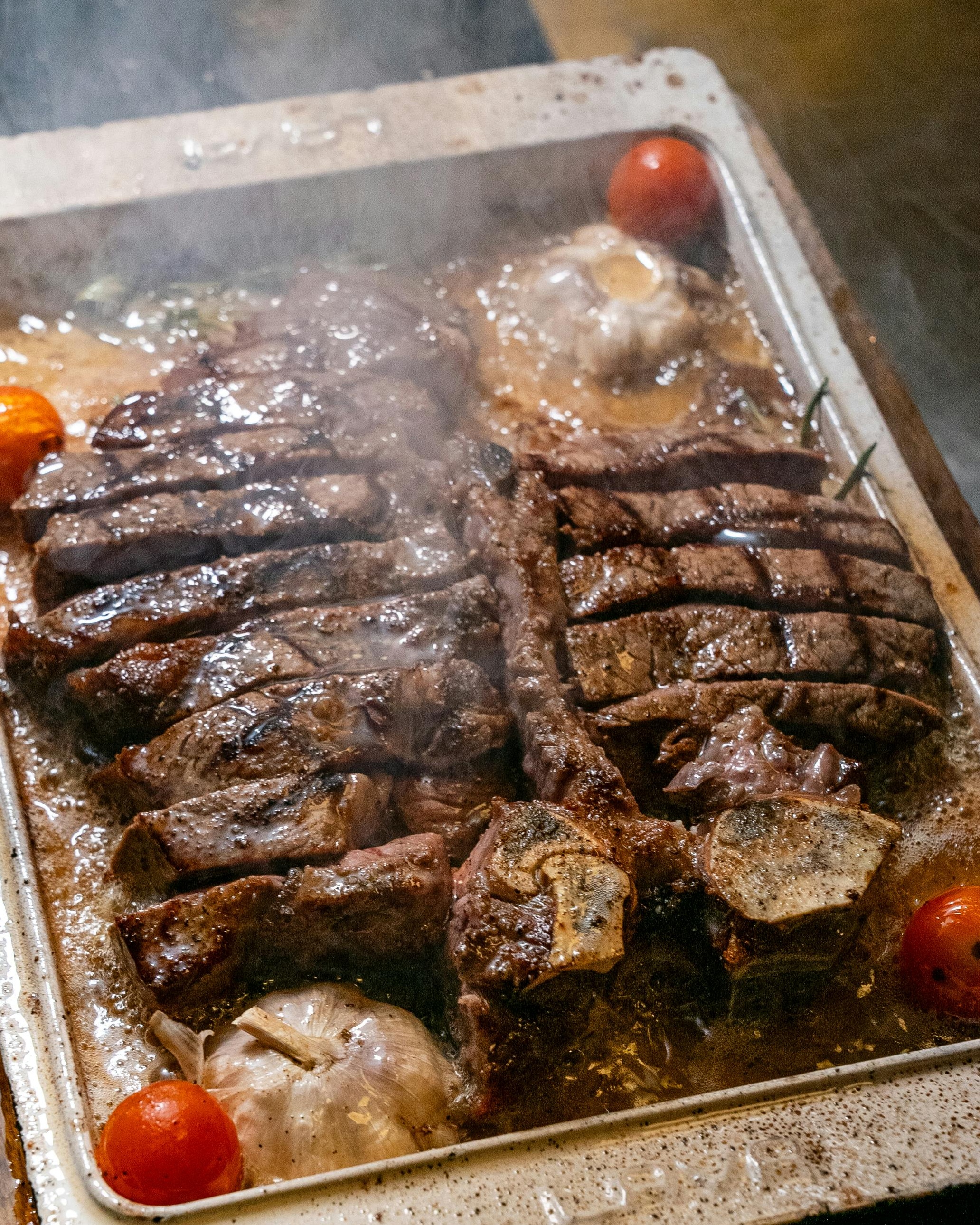 Sliced Roasted T-Bone Steak in Baking Tray