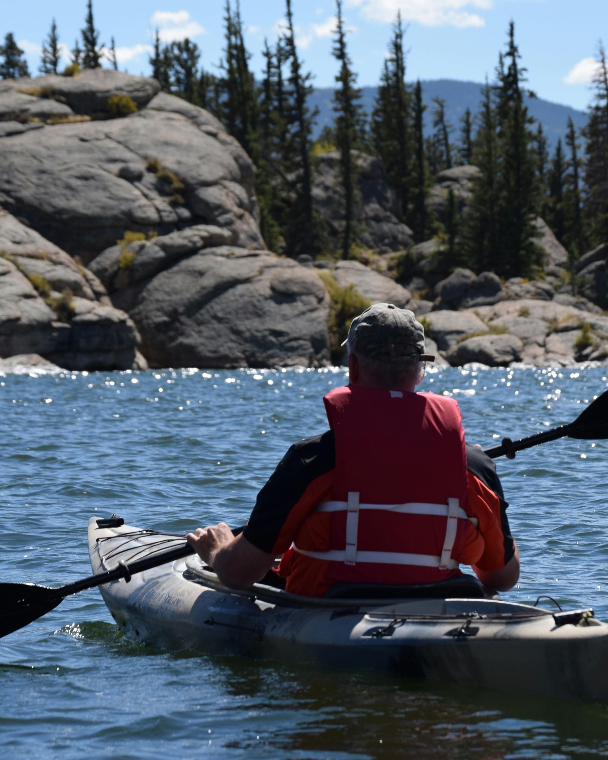 Kayaker on Rocky Mountain Lake