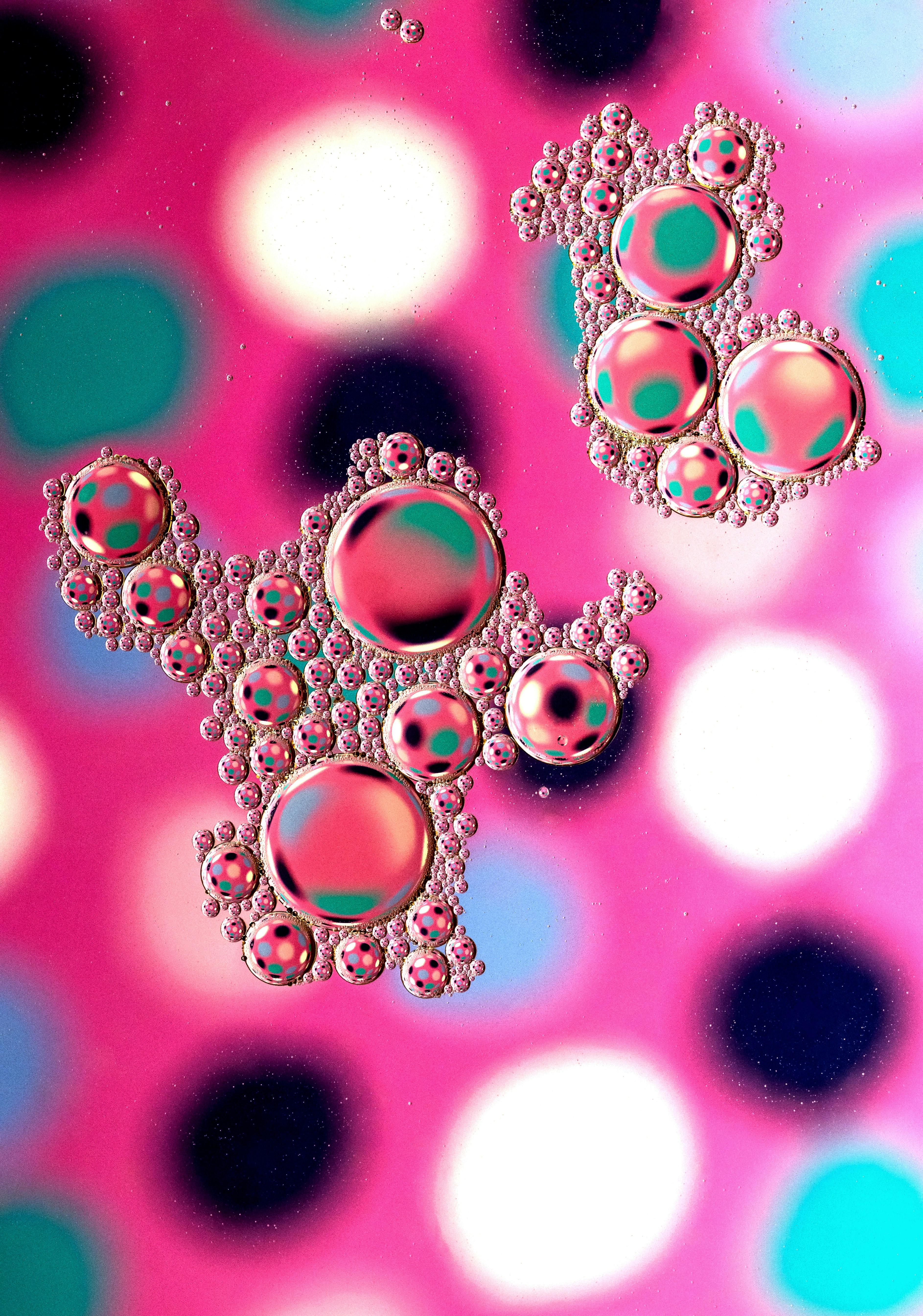 Clustered Reflective Bubbles on Pink Background