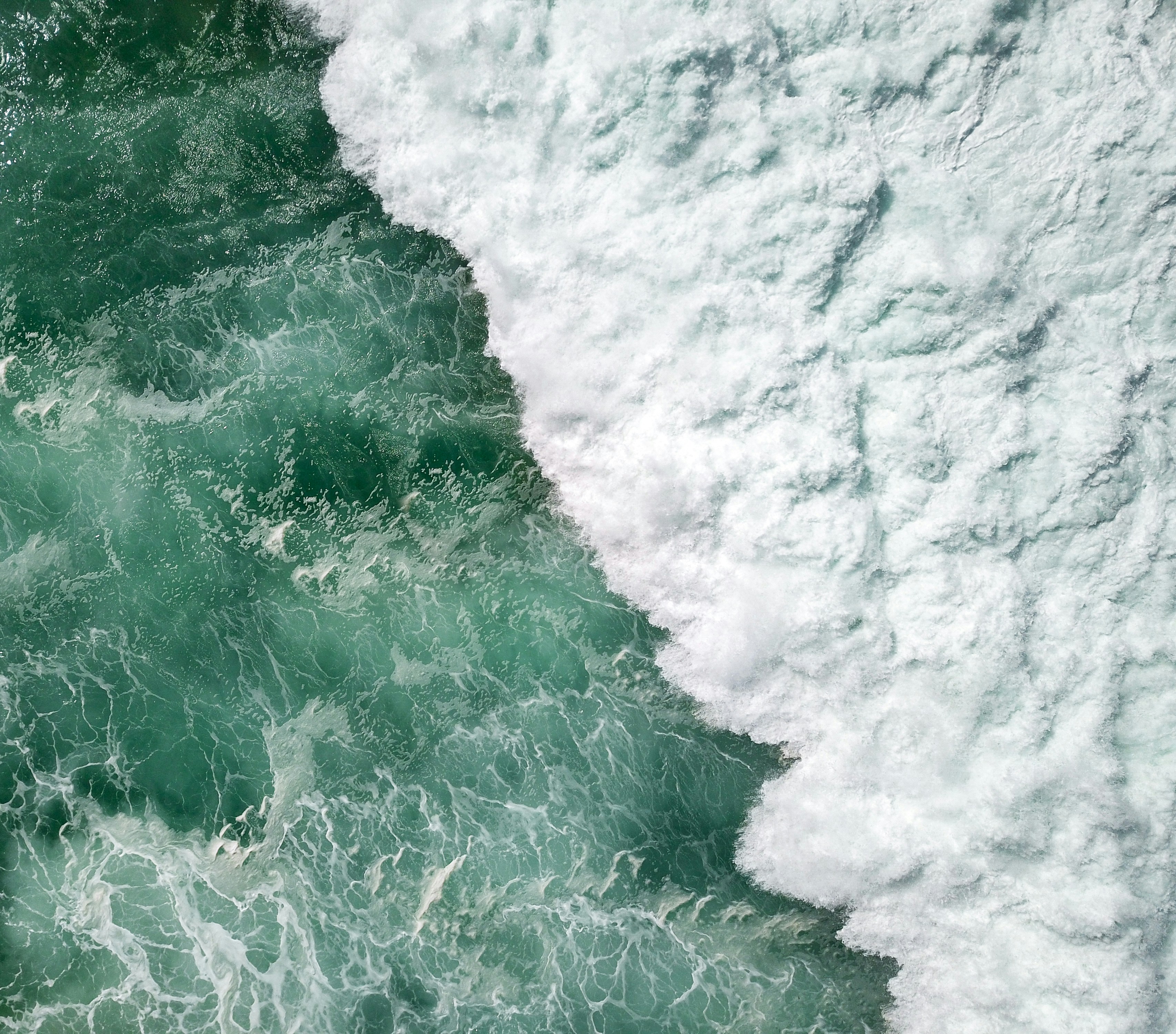Aerial View of Breaking Ocean Wave
