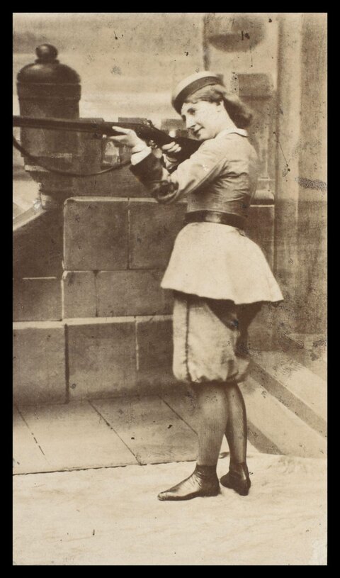 Vintage Portrait of Woman Aiming Rifle