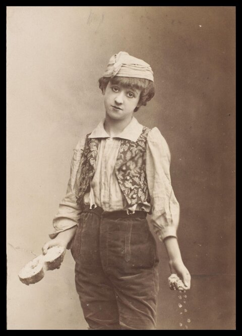 Vintage Stage Performer Holding Bread