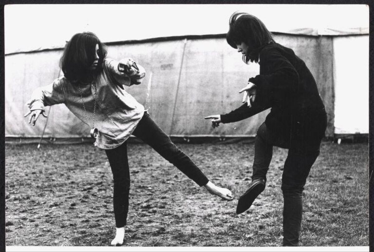 Two People Playful Duel Outdoors