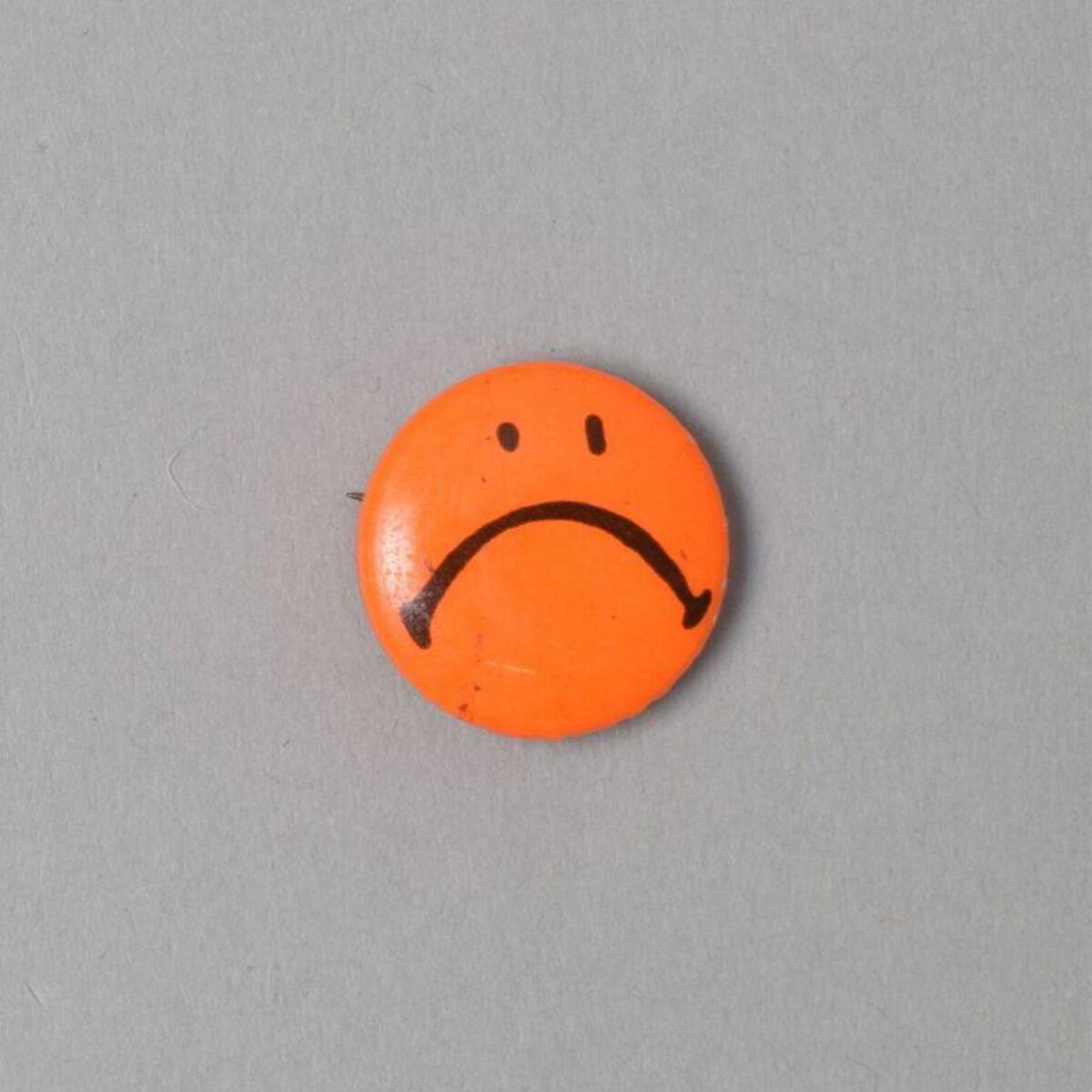 Orange Sad Face Pin Badge