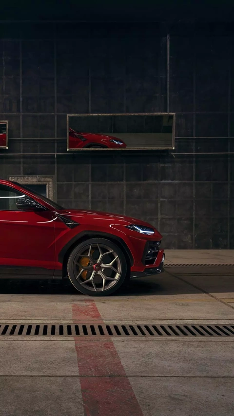Red Lamborghini SUV in Garage