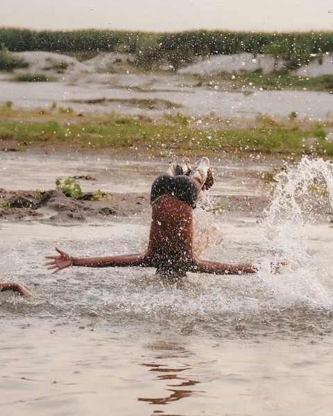 Person Diving Into Shallow River Water
