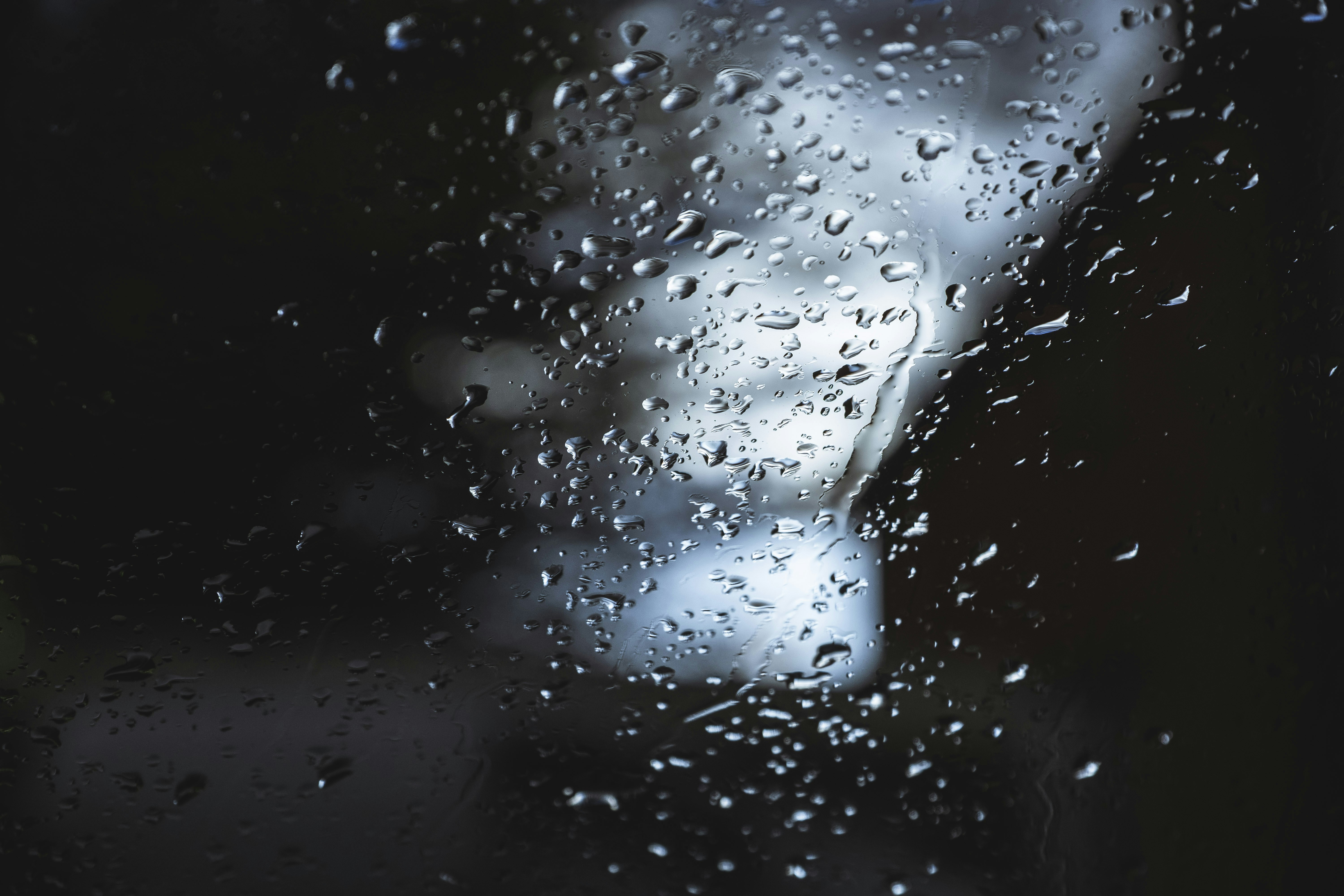 Raindrops on Glass at Night