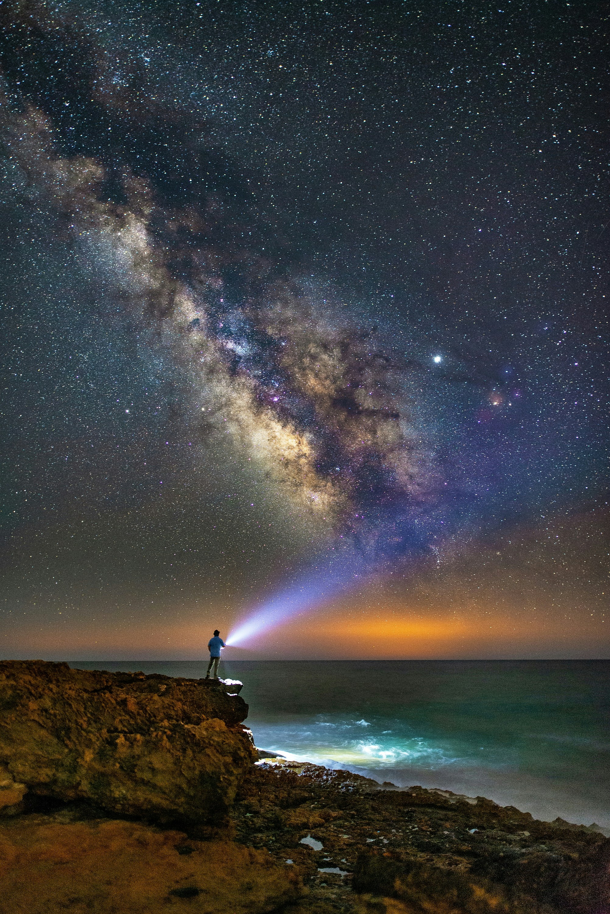 Man On Coastal Cliff Under Milky Way