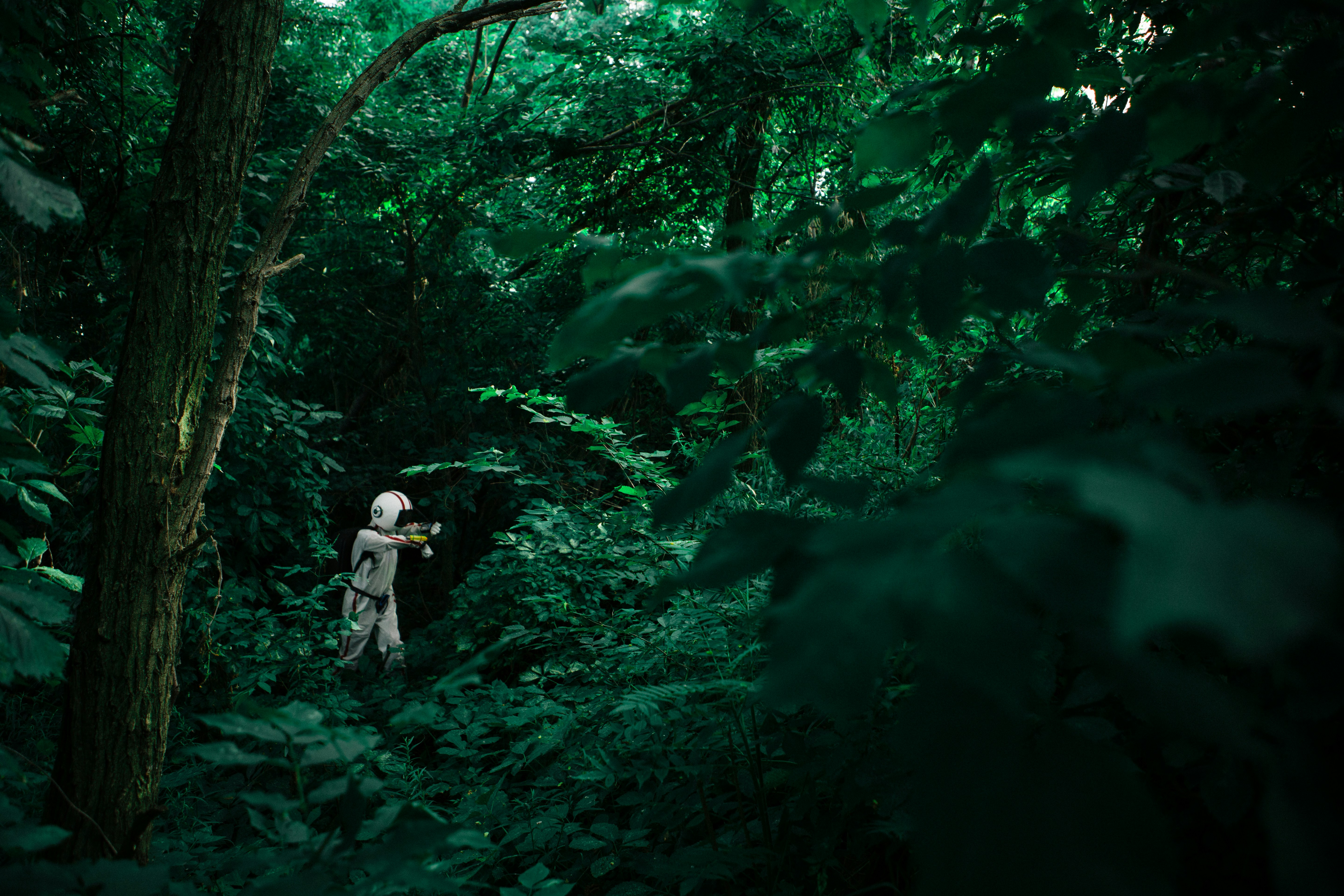 Astronaut Explorer in Dense Forest
