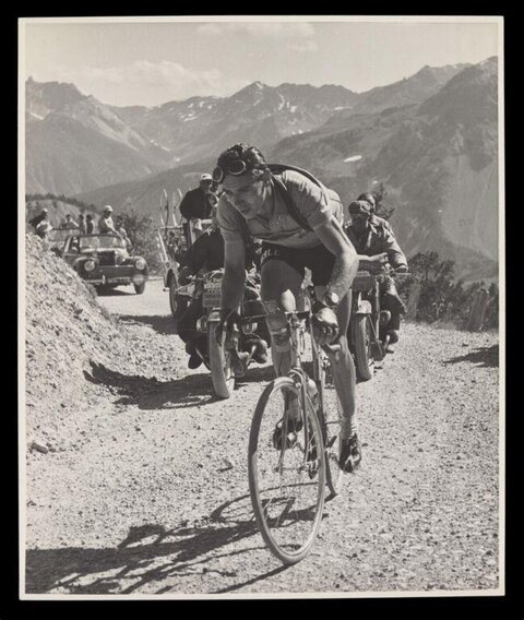 Vintage Cyclist Climbing Mountain Road