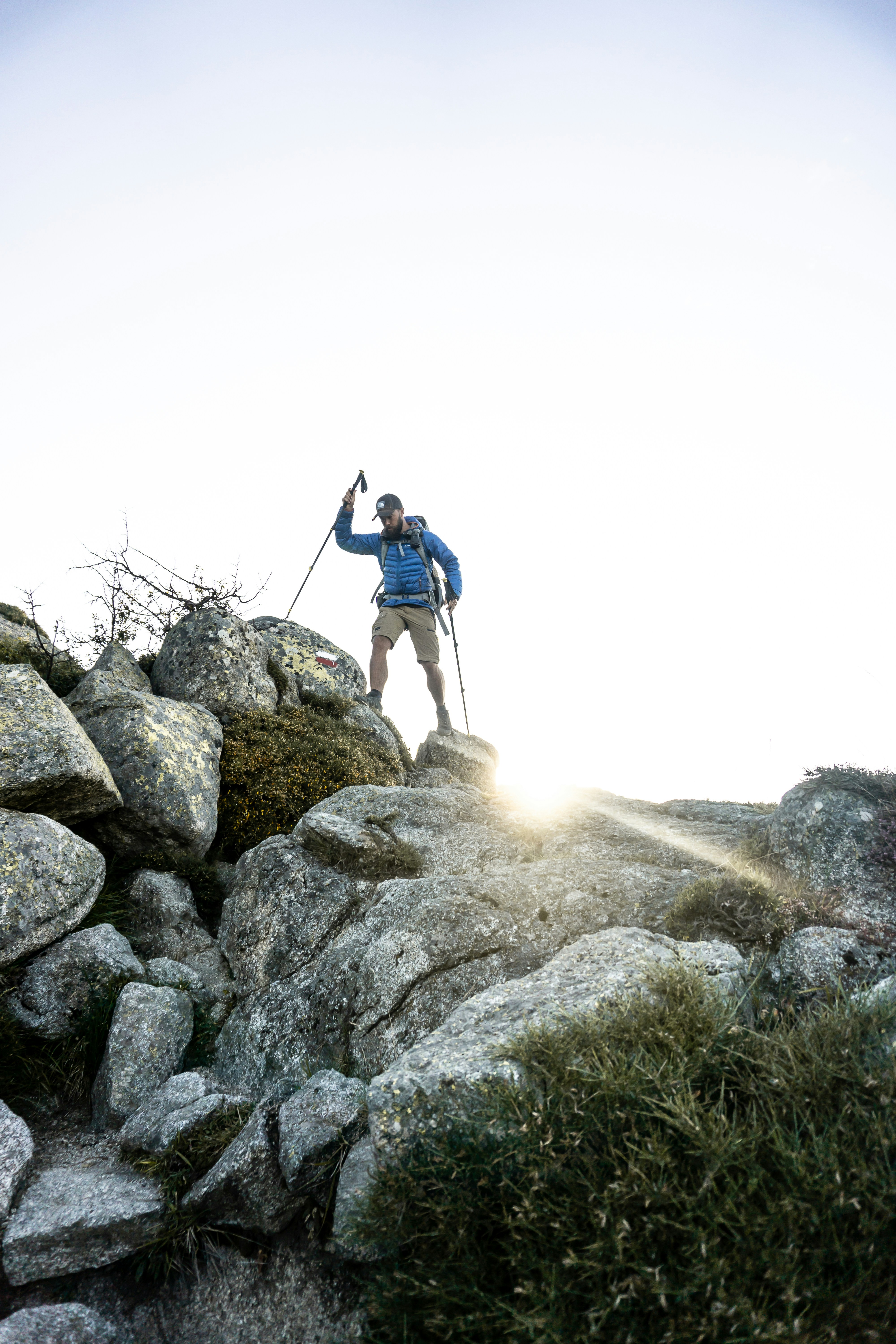 Hiker Climbing Rocky Mountain Trail
