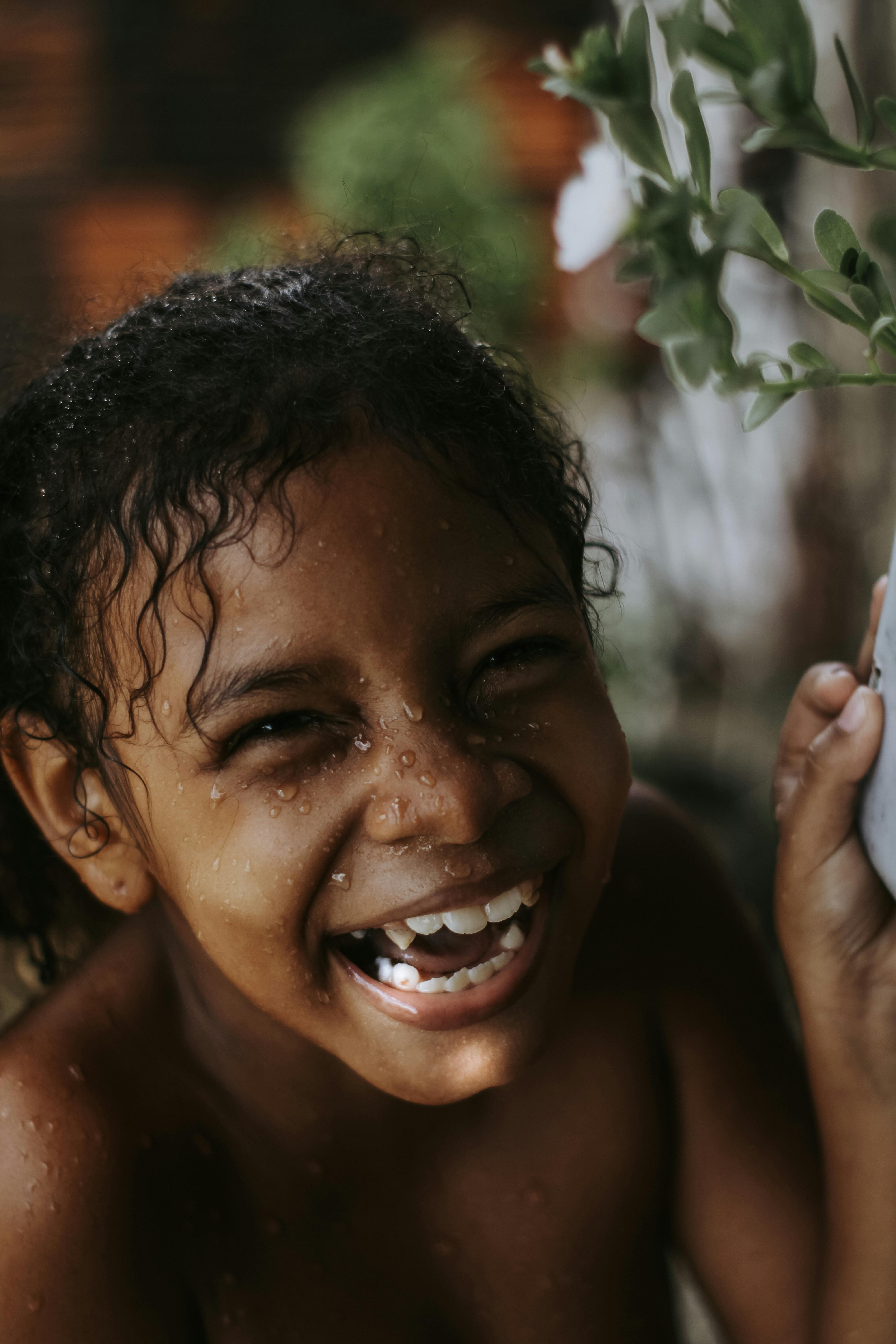 Laughing Girl With Water Droplets