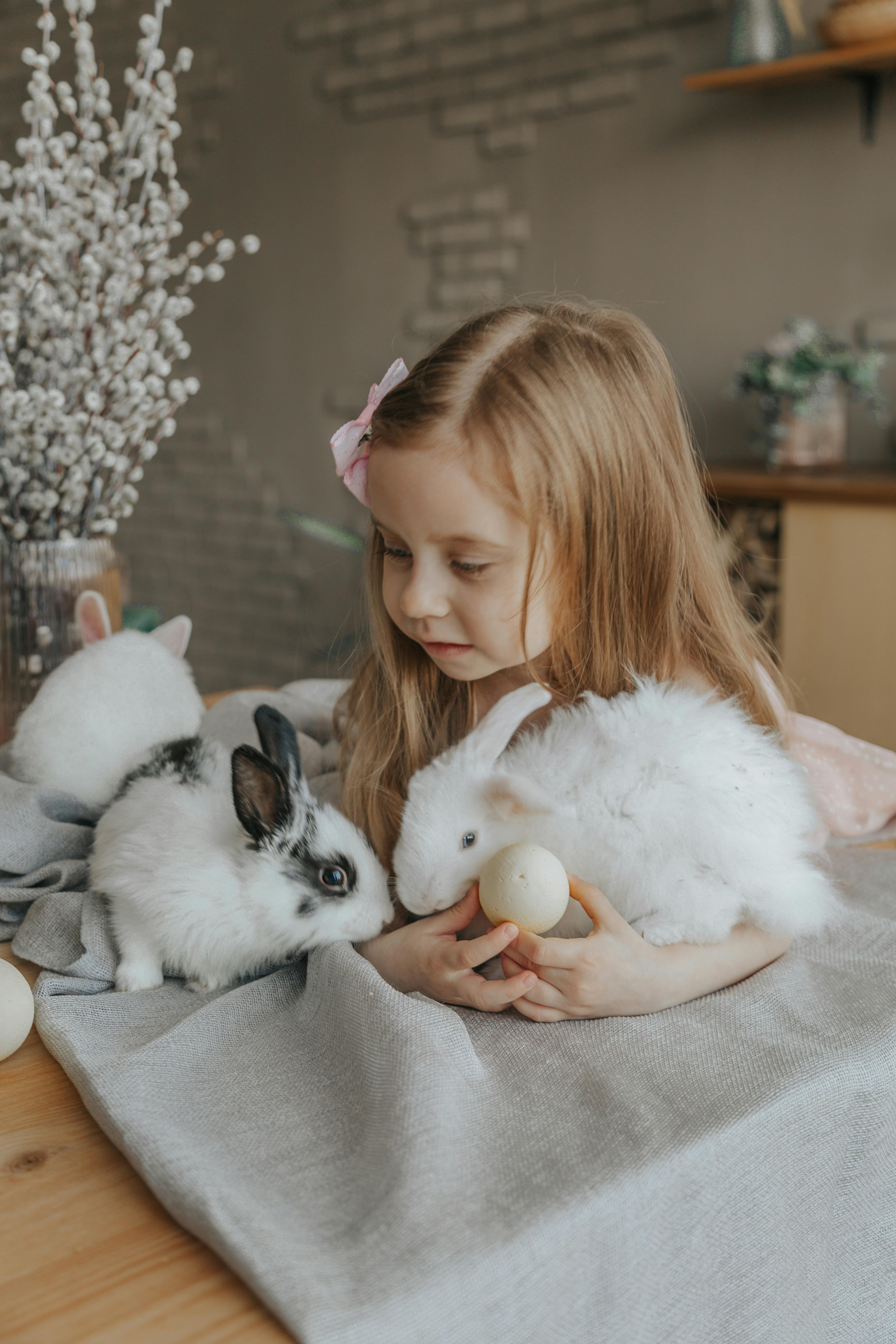 Little Girl With Bunnies and Easter Eggs