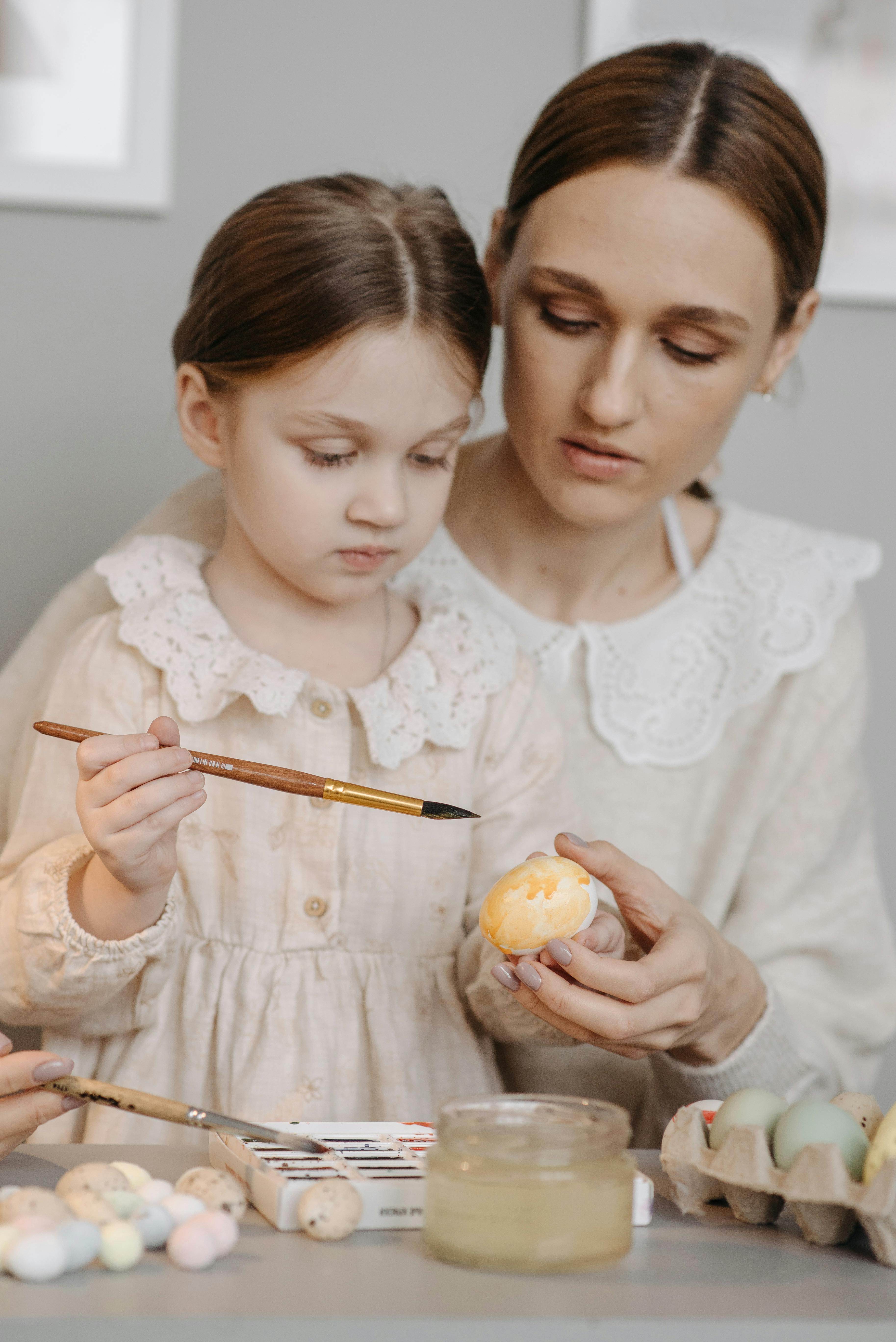 Mother and Daughter Painting Easter Eggs