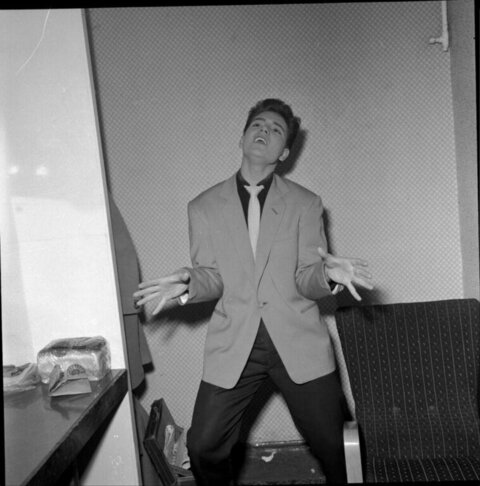 Expressive Young Man in Indoor Room
