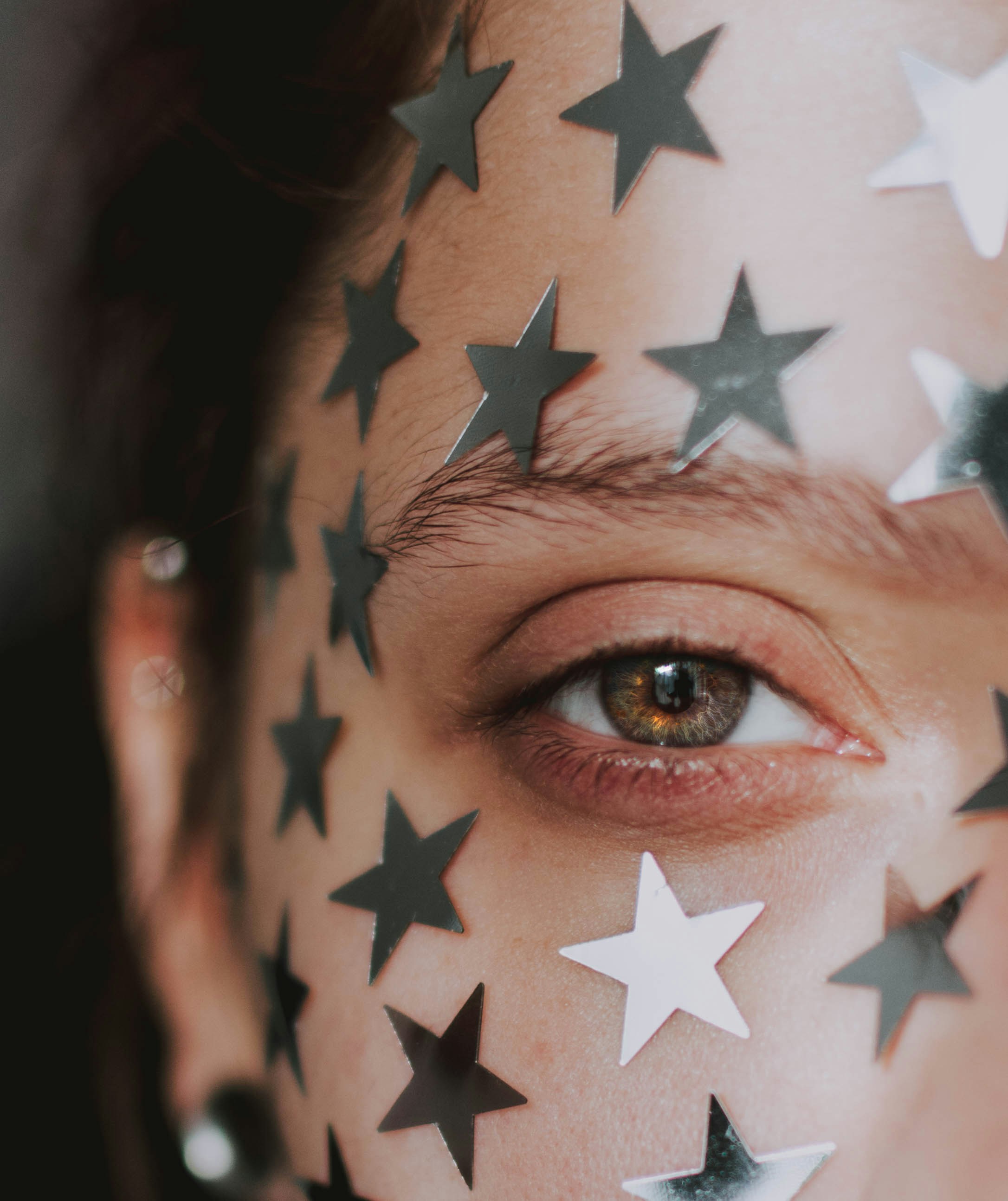 Close-up of Face with Star Stickers