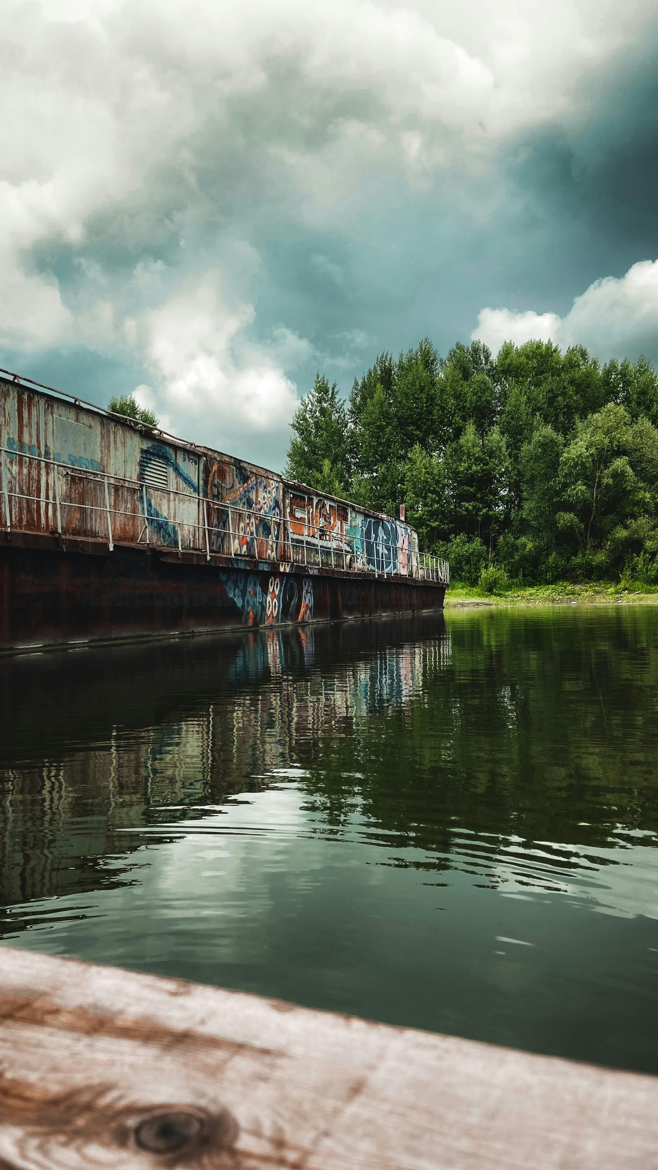 Abandoned Graffiti Barge on Calm River