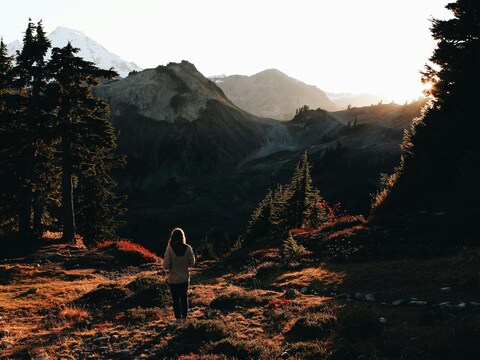 Hiker Overlooking Mountain Valley at Sunset