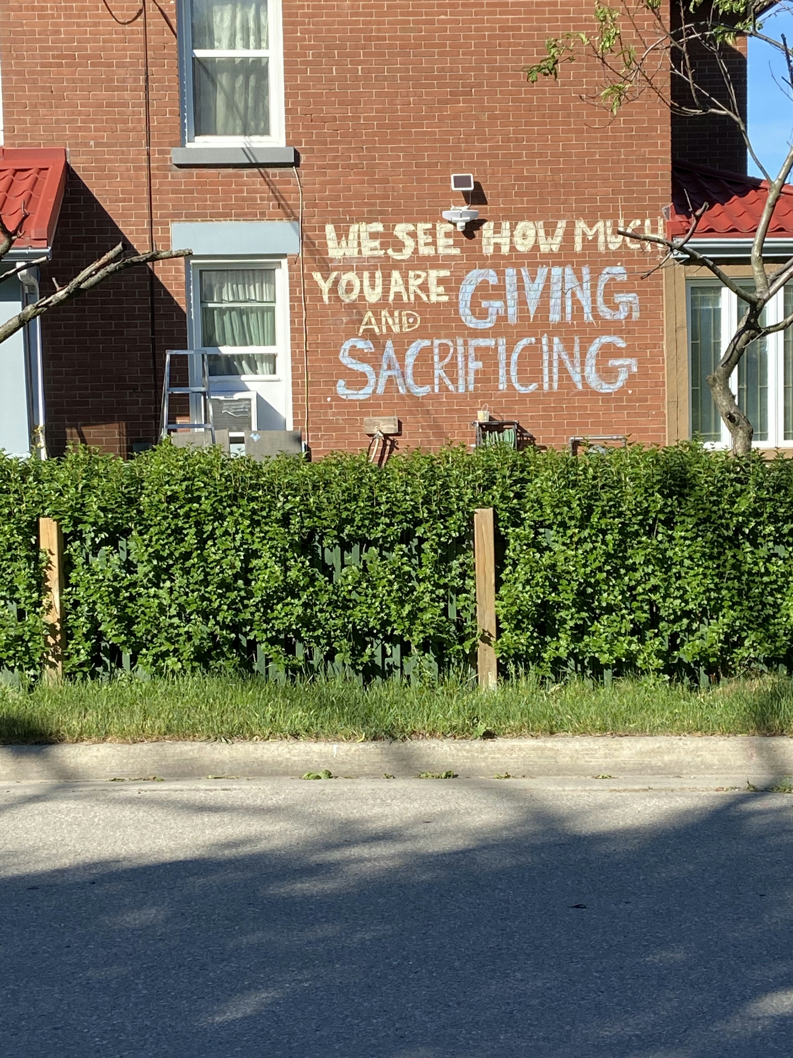 Supportive Message on Brick Building Wall