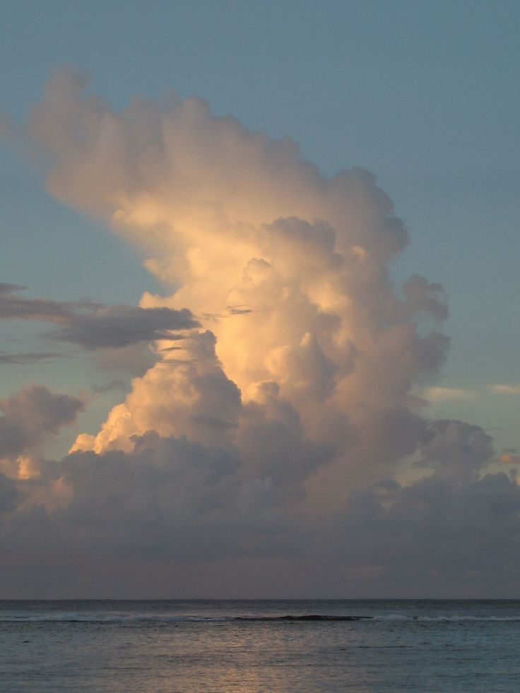 Giant Golden Cloud Over Ocean At Dusk