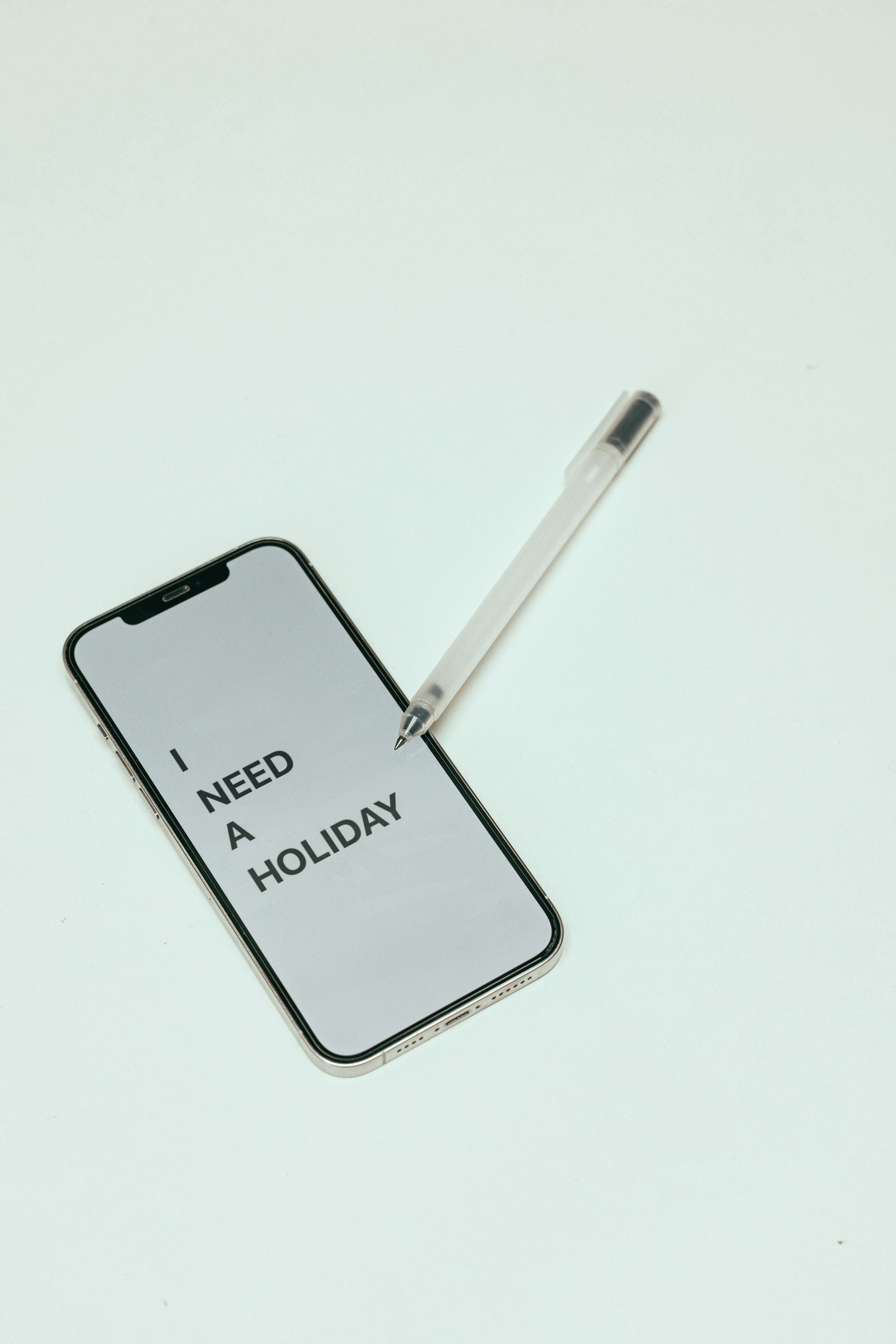 Smartphone Showing I Need A Holiday Text