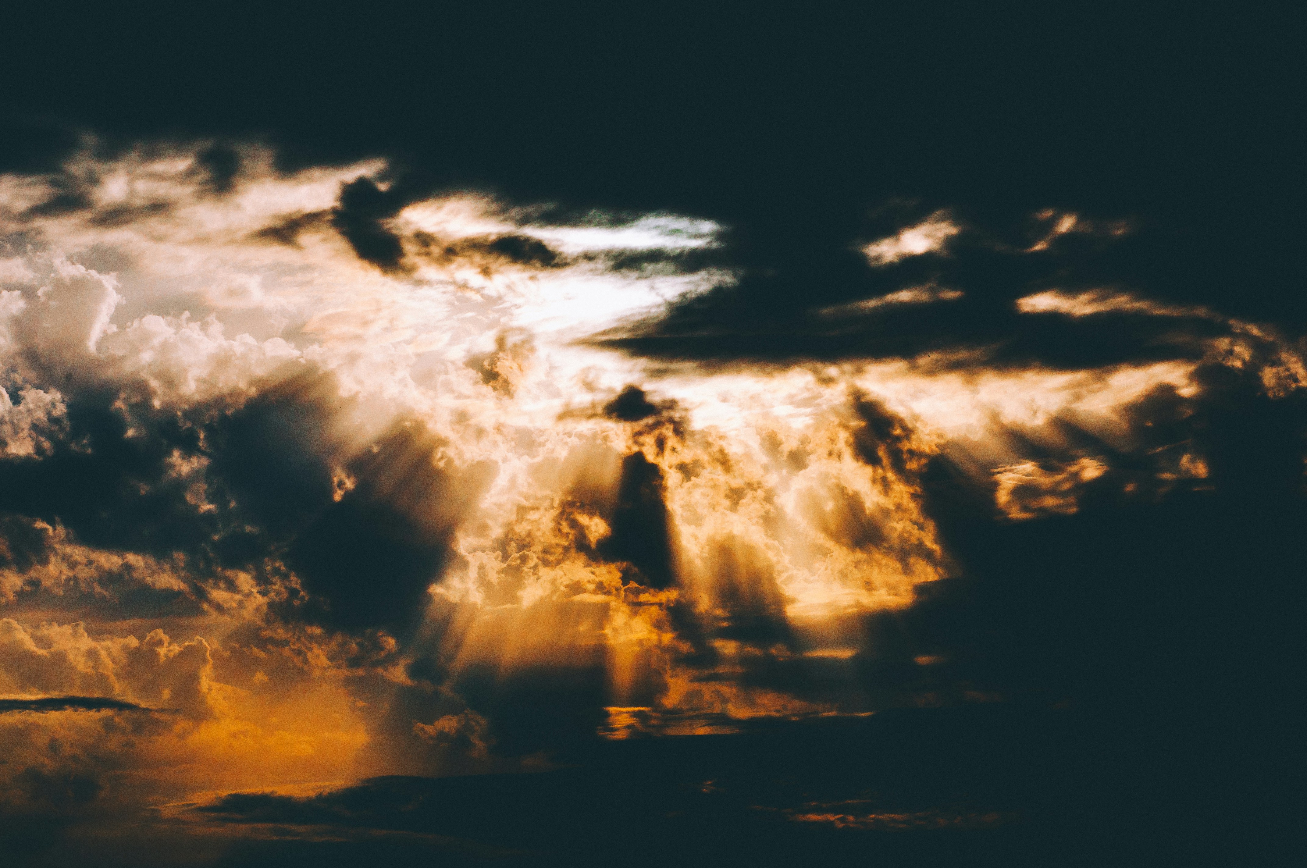 Sunbeams Breaking Through Dark Clouds