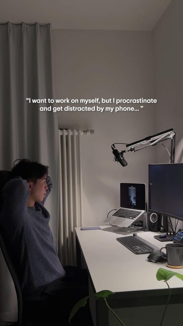 Man Procrastinating At Work Desk